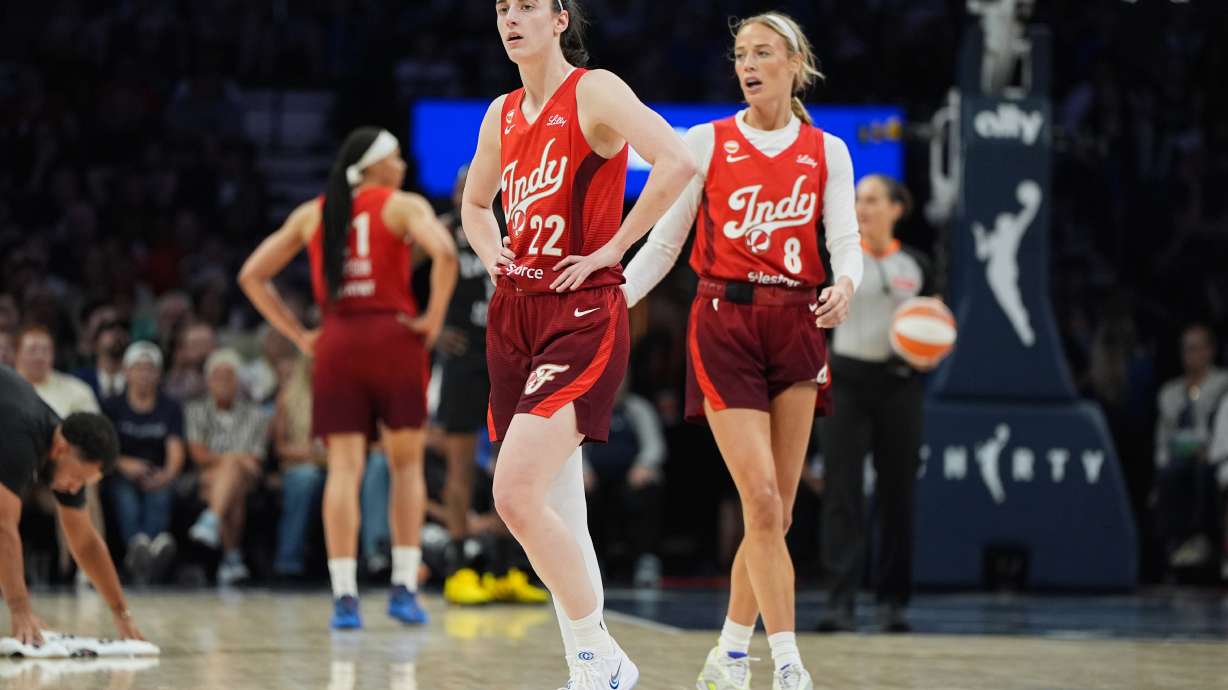 Indiana Fever guards Caitlin Clark (22) and Sophie Cunningham (8) wait for play to resume during the second half of a WNBA basketball game against the Minnesota Lynx, Sunday, Aug. 2, 2026, in Minneapolis.