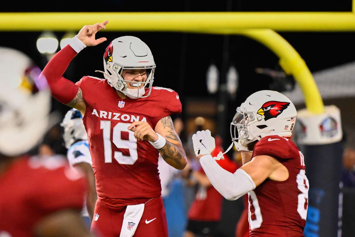 Arizona Cardinals quarterback Carson Beck (19) and wide receiver Simi Fehoko, right, celebrate after Beck threw a touchdown pass to Fehoko in the first half of the Pro Football Hall of Fame NFL preseason game in Canton, Ohio, Thursday, Aug. 6, 2026.