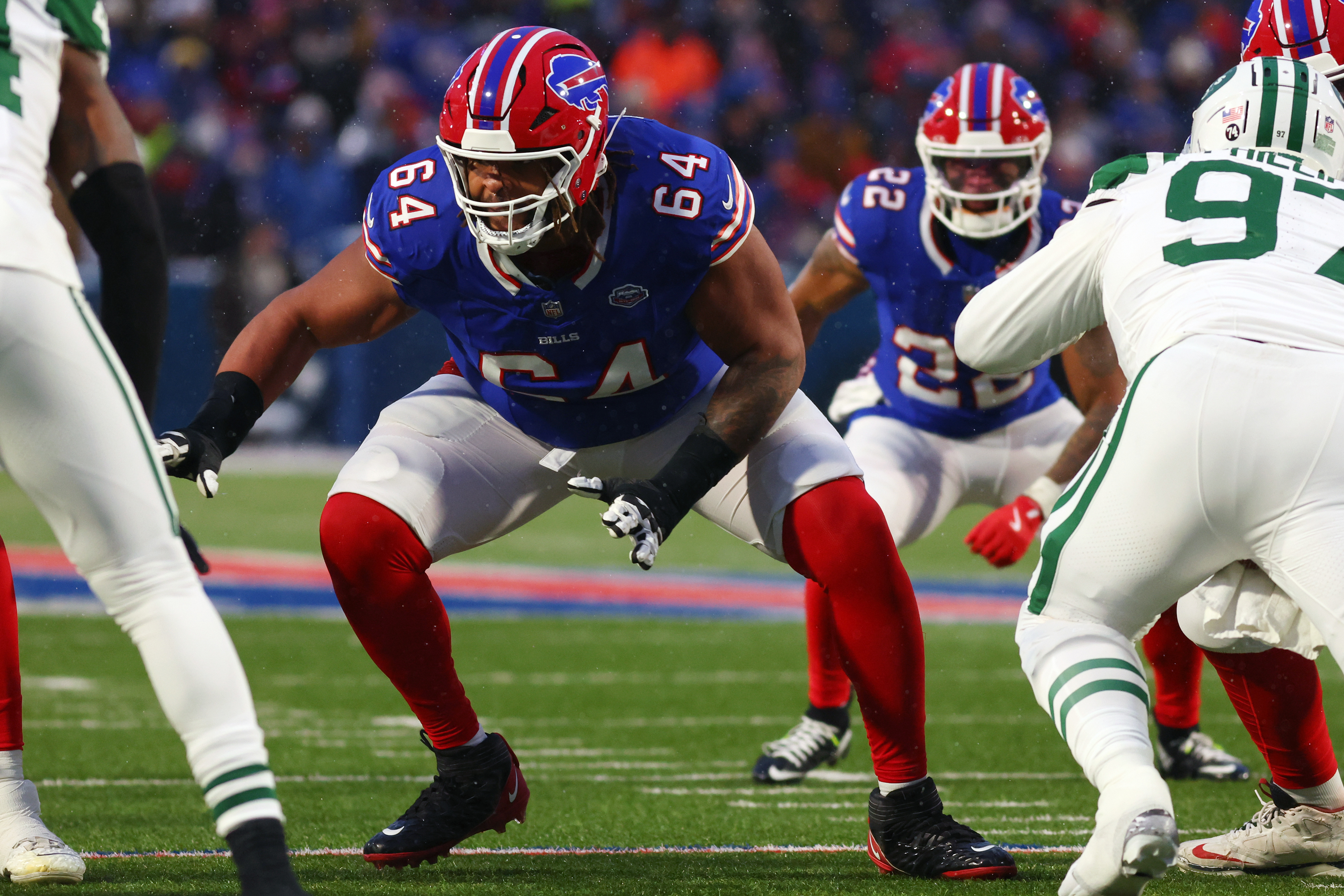 FILE - Buffalo Bills guard O'Cyrus Torrence (64) blocks during the first half of an NFL football game against the New York Jets in Orchard Park, N.Y., Sunday Jan. 4, 2026. 