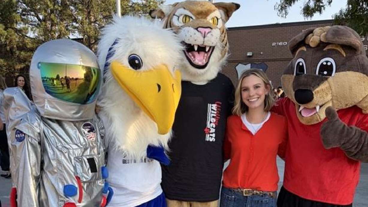 Madi Vollmer with Jordan School District mascots. Jordan School District welcomed nearly 200 new teachers Friday with a celebratory orientation as they prepare for the start of the new school year.