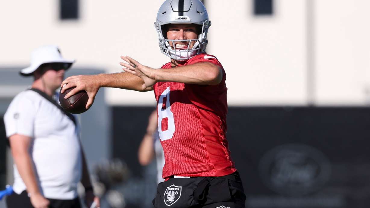 Las Vegas Raiders quarterback Kirk Cousins (8) throws a pass during practice at the team's NFL football training camp, Thursday, July 30, 2026, in Henderson, Nev.