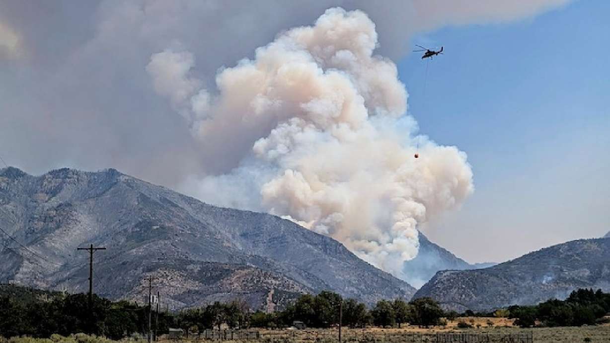 The Widemouth 2 Fire burns in Millard County on Thursday. The fire surpassed 100,000 acres on Friday, but monsoonal rain may help reduce fire risk beginning next week.