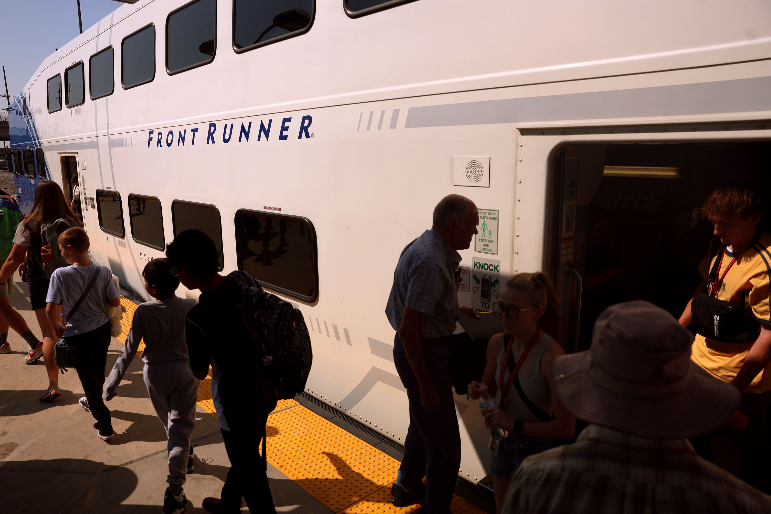 Passengers disembark a FrontRunner at the Intermodal Hub in Salt Lake City on Friday, Aug. 7, 2026.