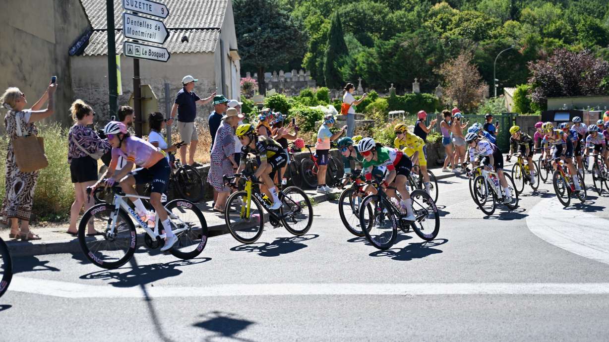 People watch the break away riders during the seventh stage of the Women's Tour de France cycling race (Tour de France Femmes) between La Voulte-sur-Rhone and Mont Ventoux in Malaucene, France, Friday, Aug. 7, 2026.