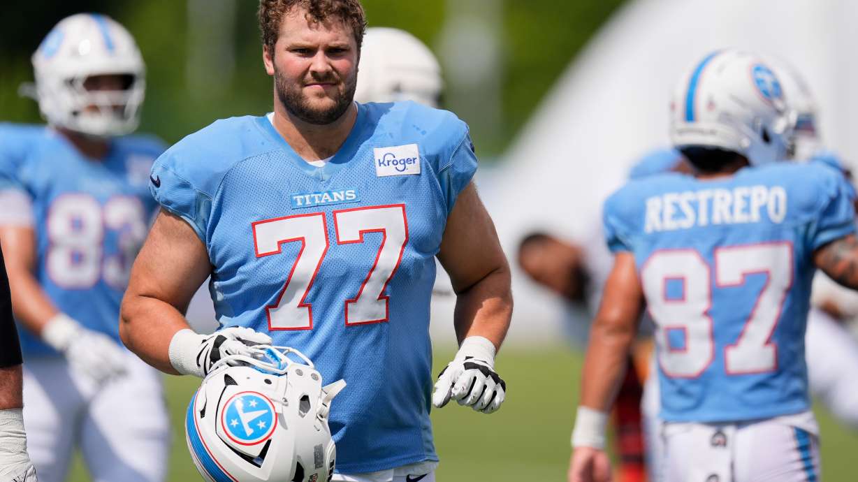 Tennessee Titans guard Peter Skoronski (77) warms up during the NFL football team's training camp Tuesday, Aug. 4, 2026, in Nashville, Tenn.