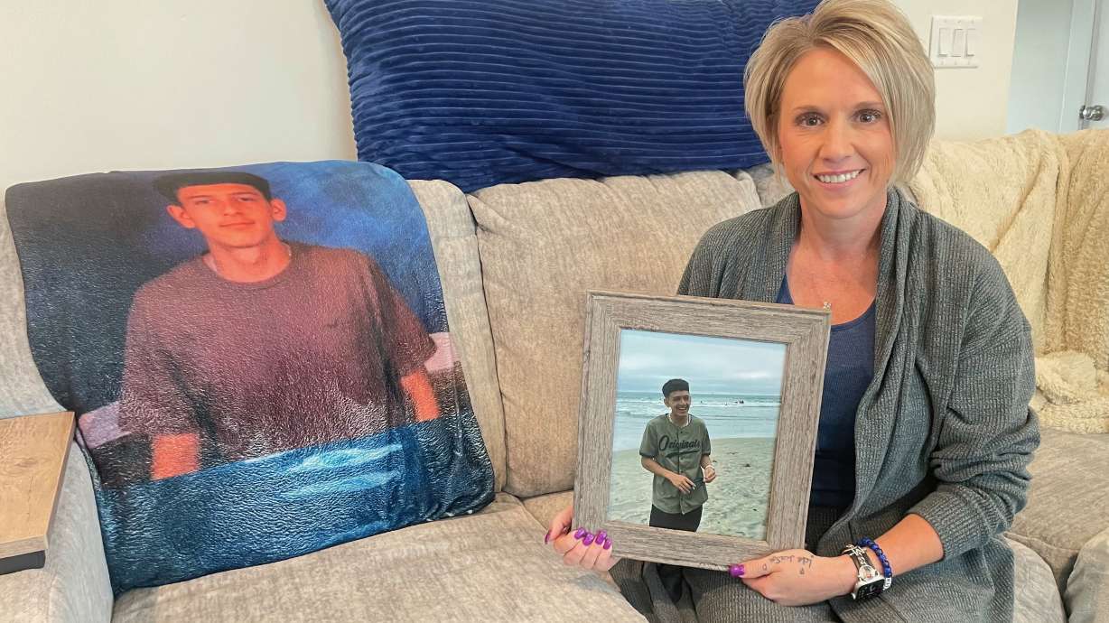 Leslie Caballero, the mother of Mason Caballero, killed in a shooting in Ogden last year, struggles forward with a message to parents — be involved in your kids' lives. She's pictured with a photo of Mason at her home in Taylor on July 30.