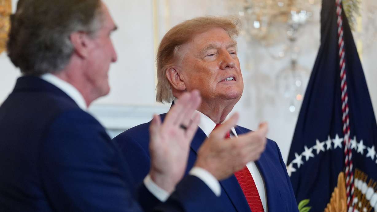 President Donald Trump arrives to a roundtable on the American mining industry, Friday, at the State Department in Washington, as Interior Secretary Doug Burgum applauds. University of Utah President Taylor Randall was also in attendance.