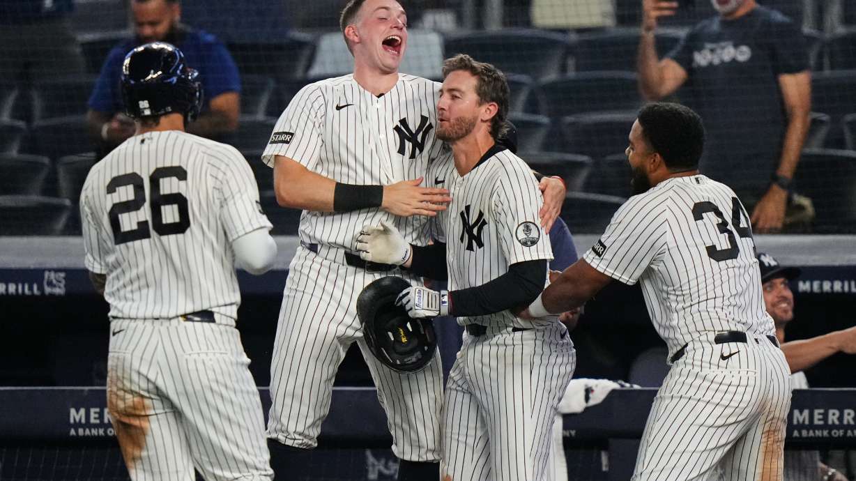 New York Yankees' Ryan McMahon, center, celebrates with Heliot Ramos, right, Ben Rice, second from left, and Luis García Jr. after a baseball game against the Atlanta Braves Saturday, Aug. 8, 2026, in New York.