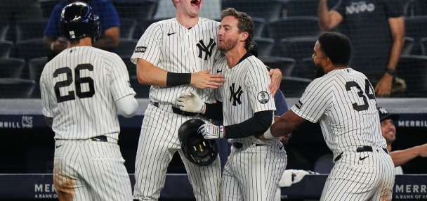 Yankees rally with 2 outs in 9th inning and beat Braves 3-2 in 10 after long rain delay