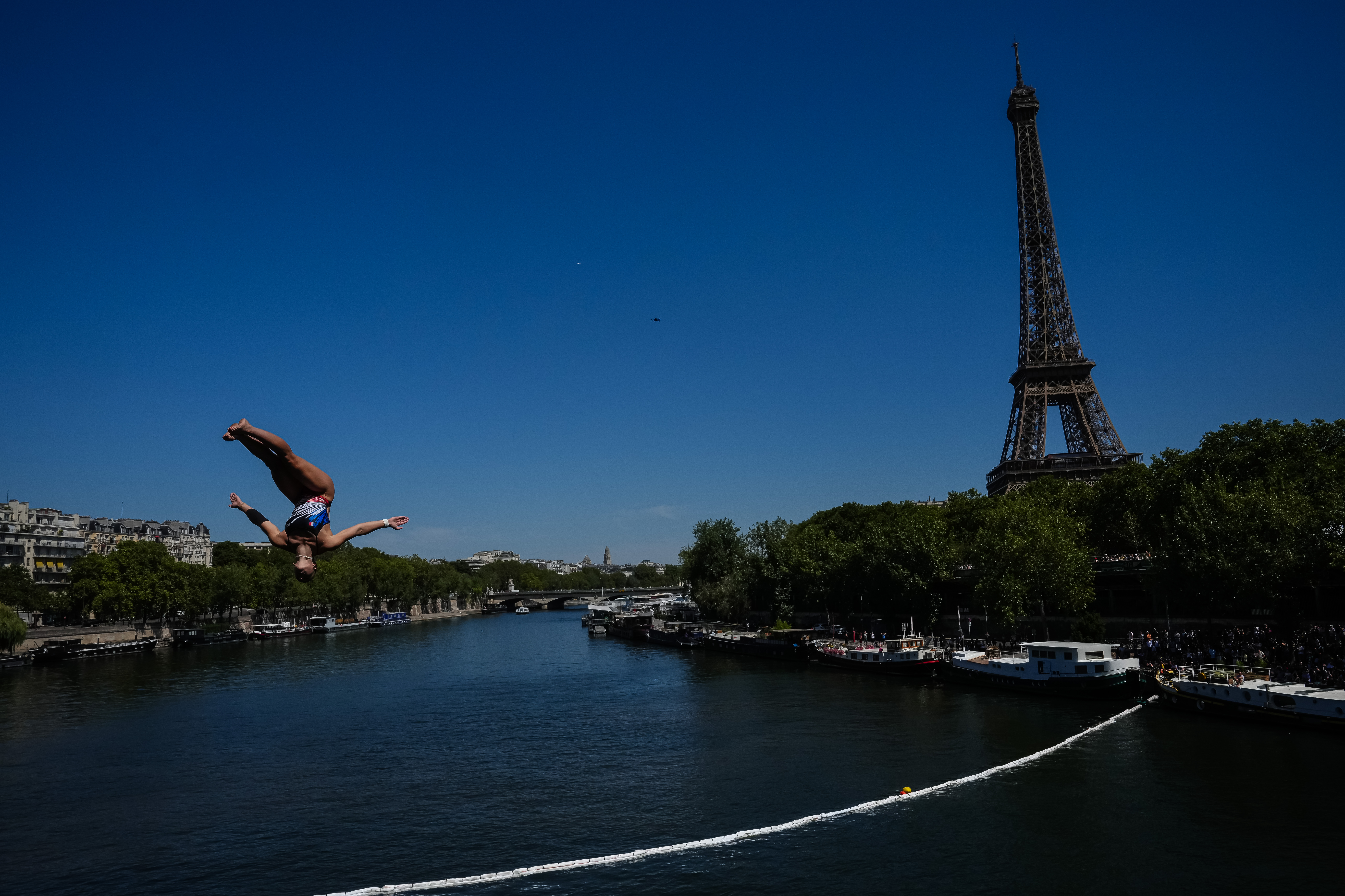 France's Madeleine Bayon competes during round 1 of the Women's 20m Platform as the Eiffel Tower is seen in the background at the European Aquatics Championships in Paris, Friday, Aug. 7, 2026. 