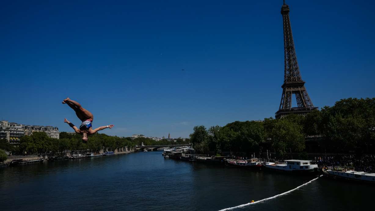 France's Madeleine Bayon competes during round 1 of the Women's 20m Platform as the Eiffel Tower is seen in the background at the European Aquatics Championships in Paris, Friday, Aug. 7, 2026.