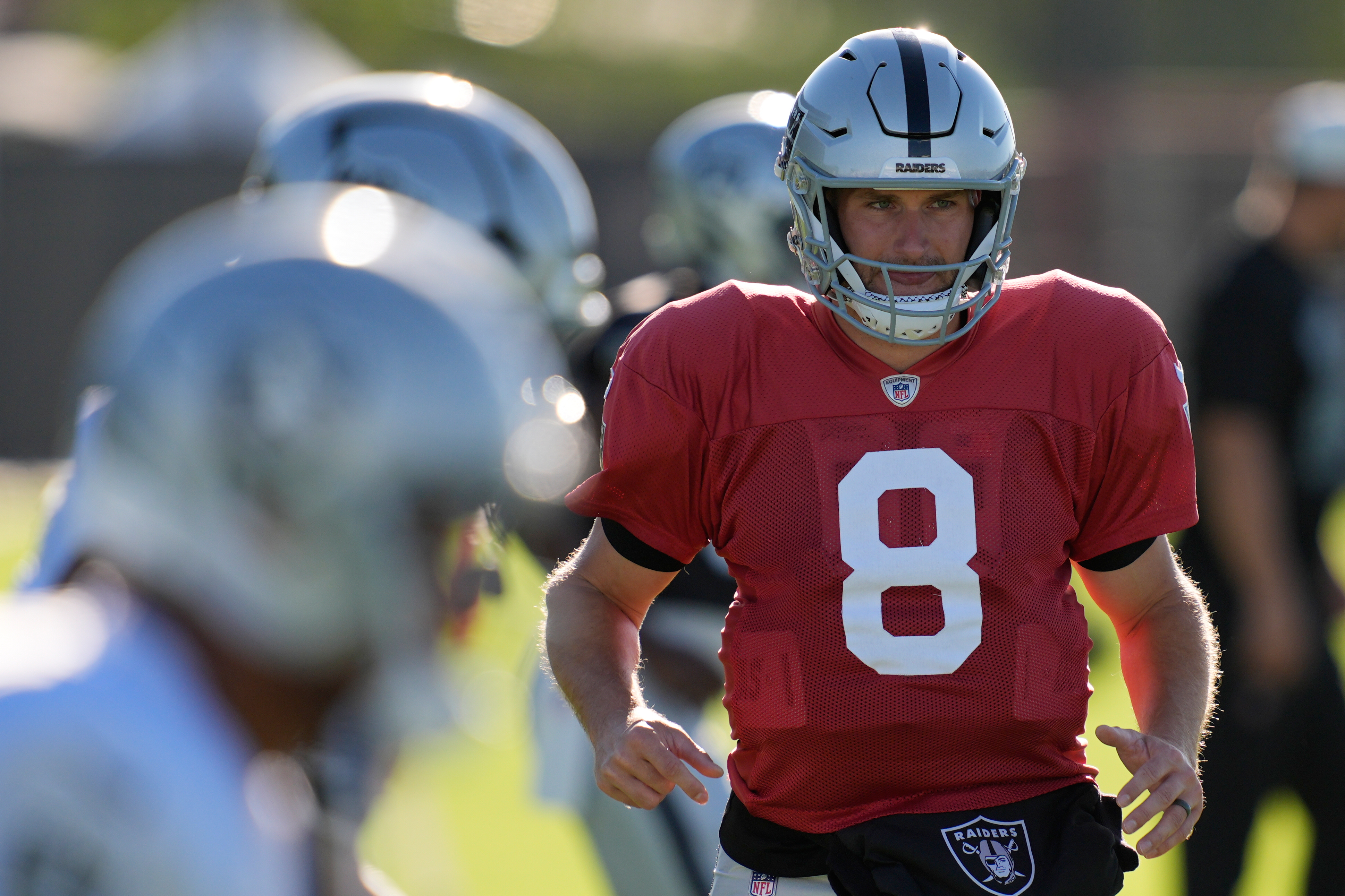 Las Vegas Raiders quarterback Kirk Cousins (8) warms up during practice at the team's NFL football training camp Tuesday, Aug. 4, 2026, in Henderson, Nev. 