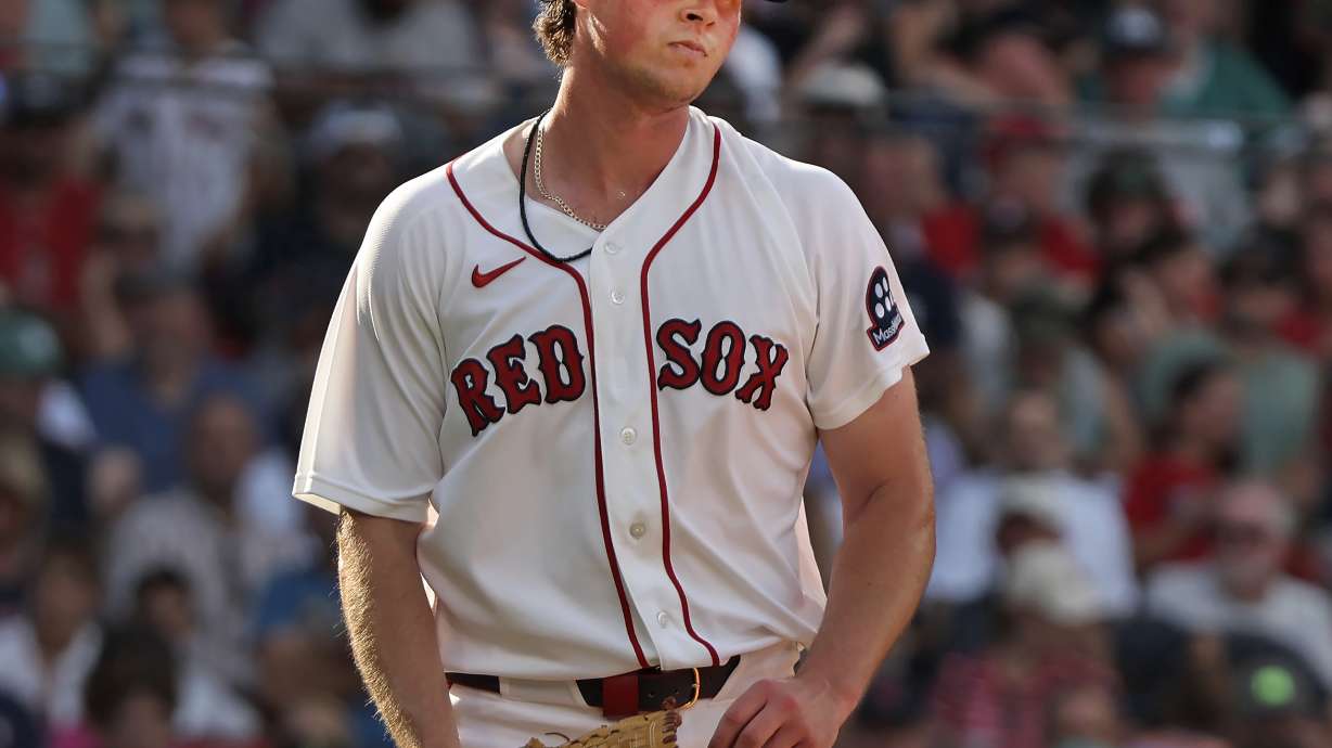 Boston Red Sox pitcher Jake Bennett reacts after giving up a run in the fifth inning of a baseball game against the Athletics, Saturday, Aug. 8, 2026 in Boston.