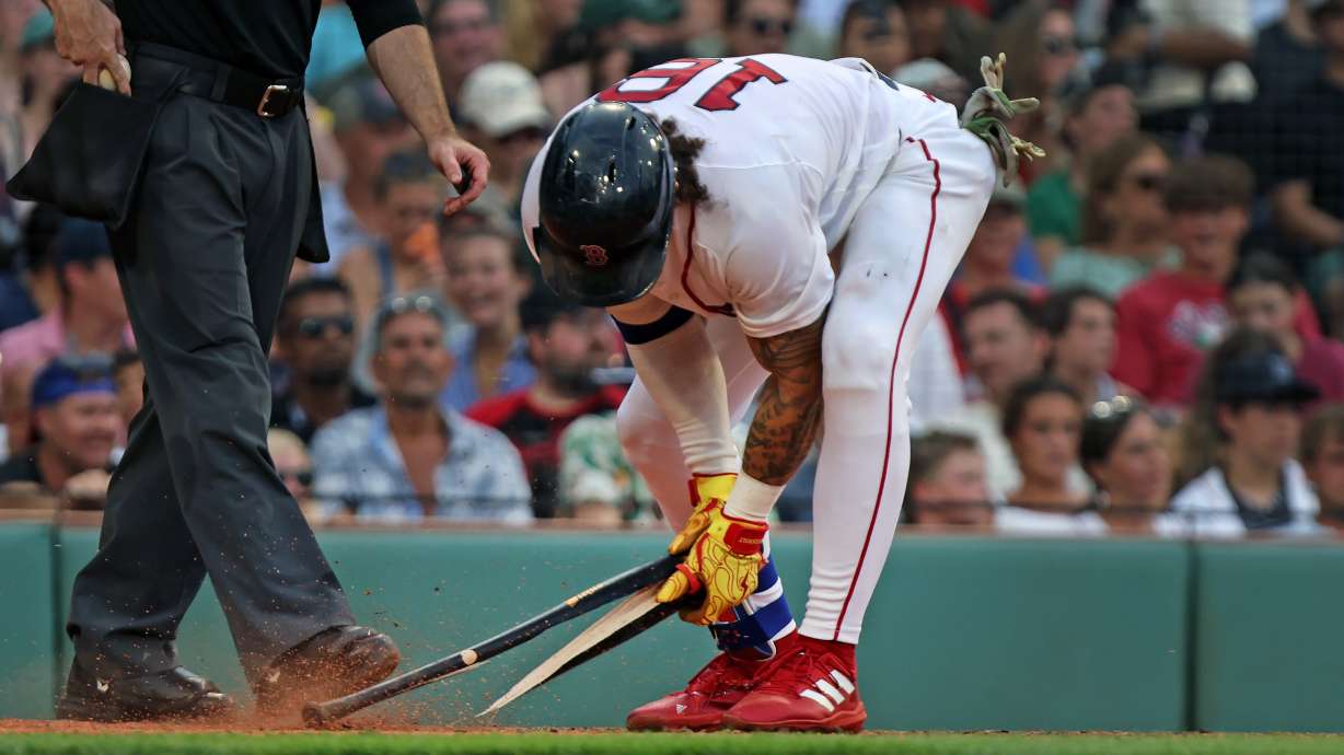 Boston Red Sox's Jarren Duran snaps his bat after striking out to end the eighth inning of a baseball game against the Athletics, Saturday, Aug. 8, 2026, in Boston.