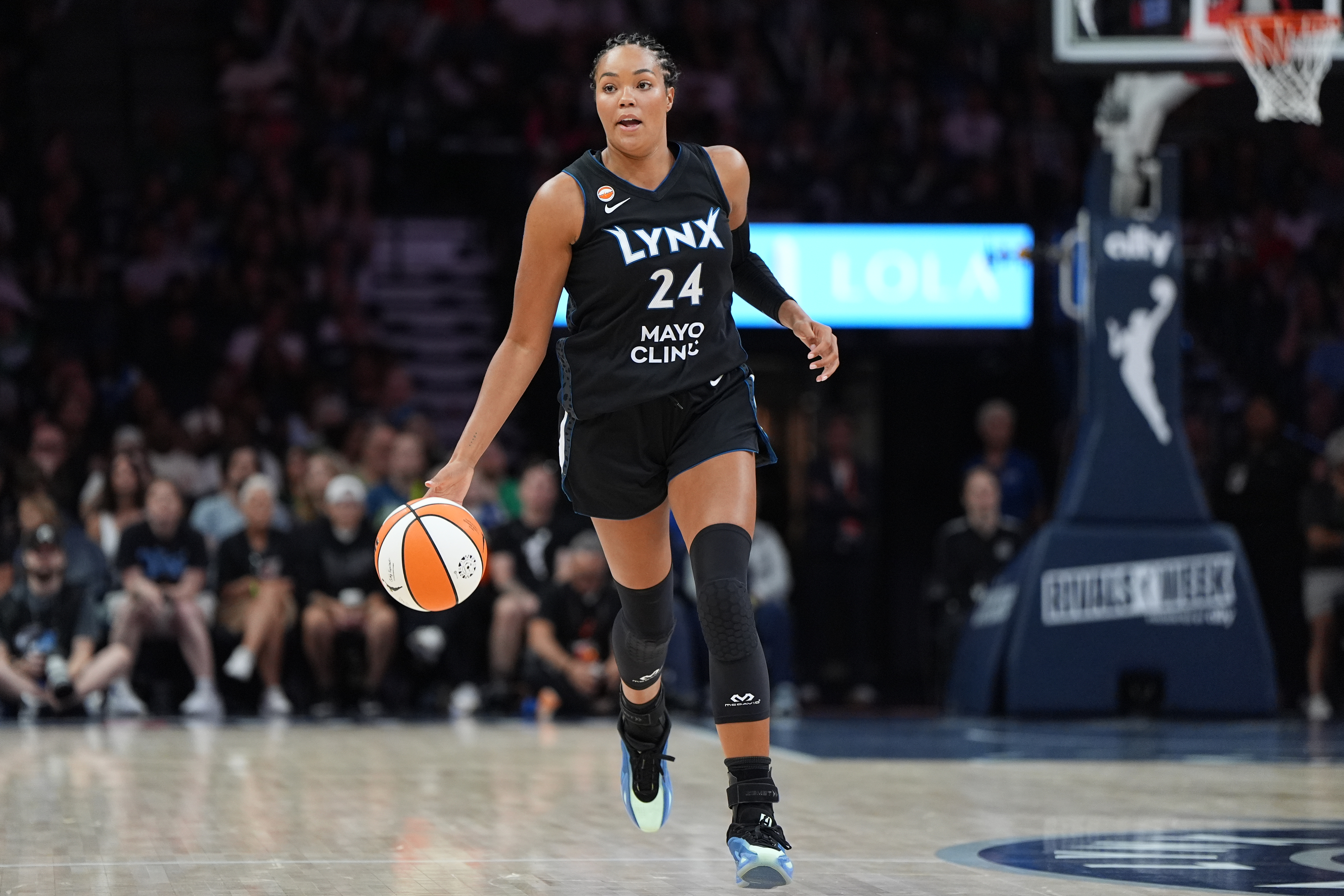Minnesota Lynx forward Napheesa Collier dribbles down the court during the first half of a WNBA basketball game against the Las Vegas Aces in Minneapolis, Saturday, Aug. 8, 2026. 
