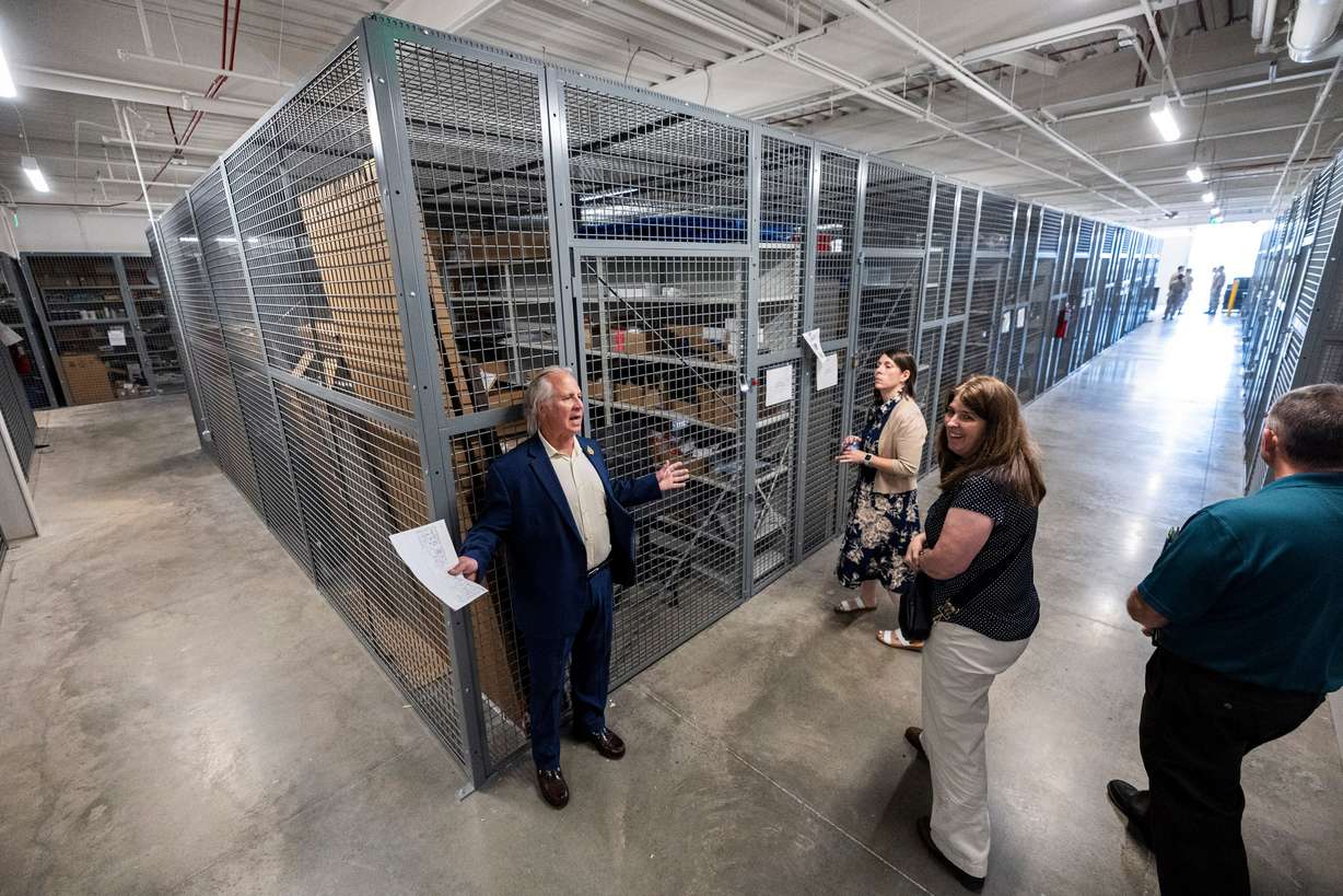 Mark Flumerfelt, a project manager and representative with the Army Reserves, talks about a storage area as he leads a tour of the Camp Williams "Deadeye" Army Reserve Center in Bluffdale on Saturday.