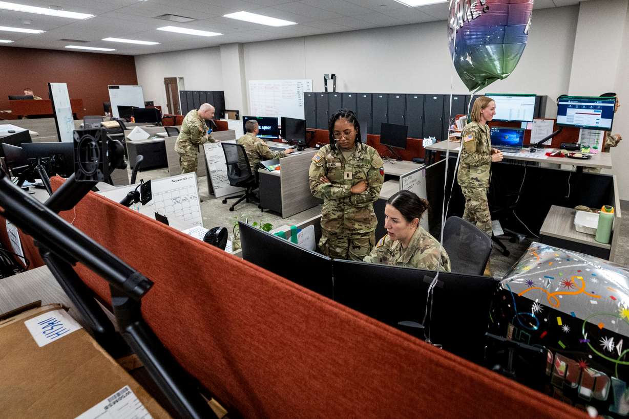 People work in workspaces inside the Camp Williams "Deadeye" Army Reserve Center in Bluffdale on Saturday.