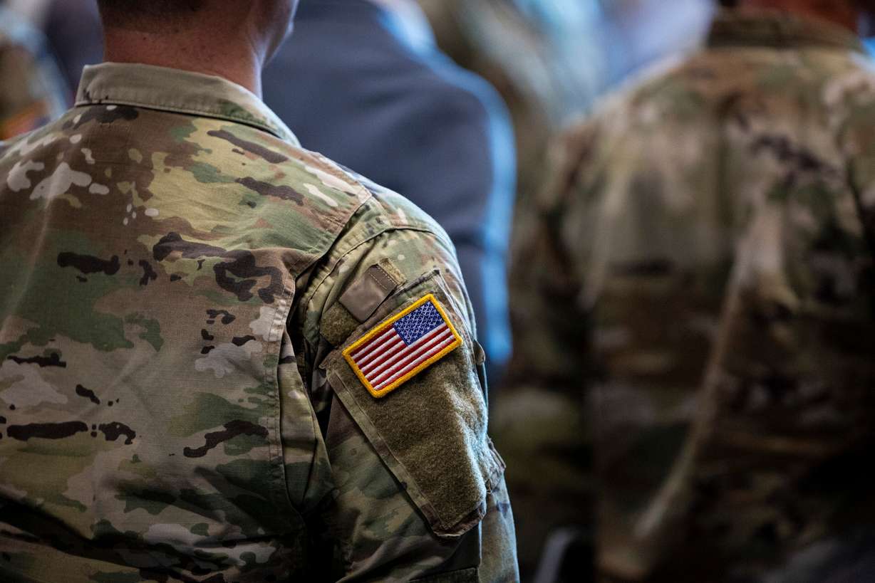 Attendees stand during a ribbon-cutting ceremony for the Camp Williams "Deadeye" Army Reserve Center in Bluffdale on Saturday.