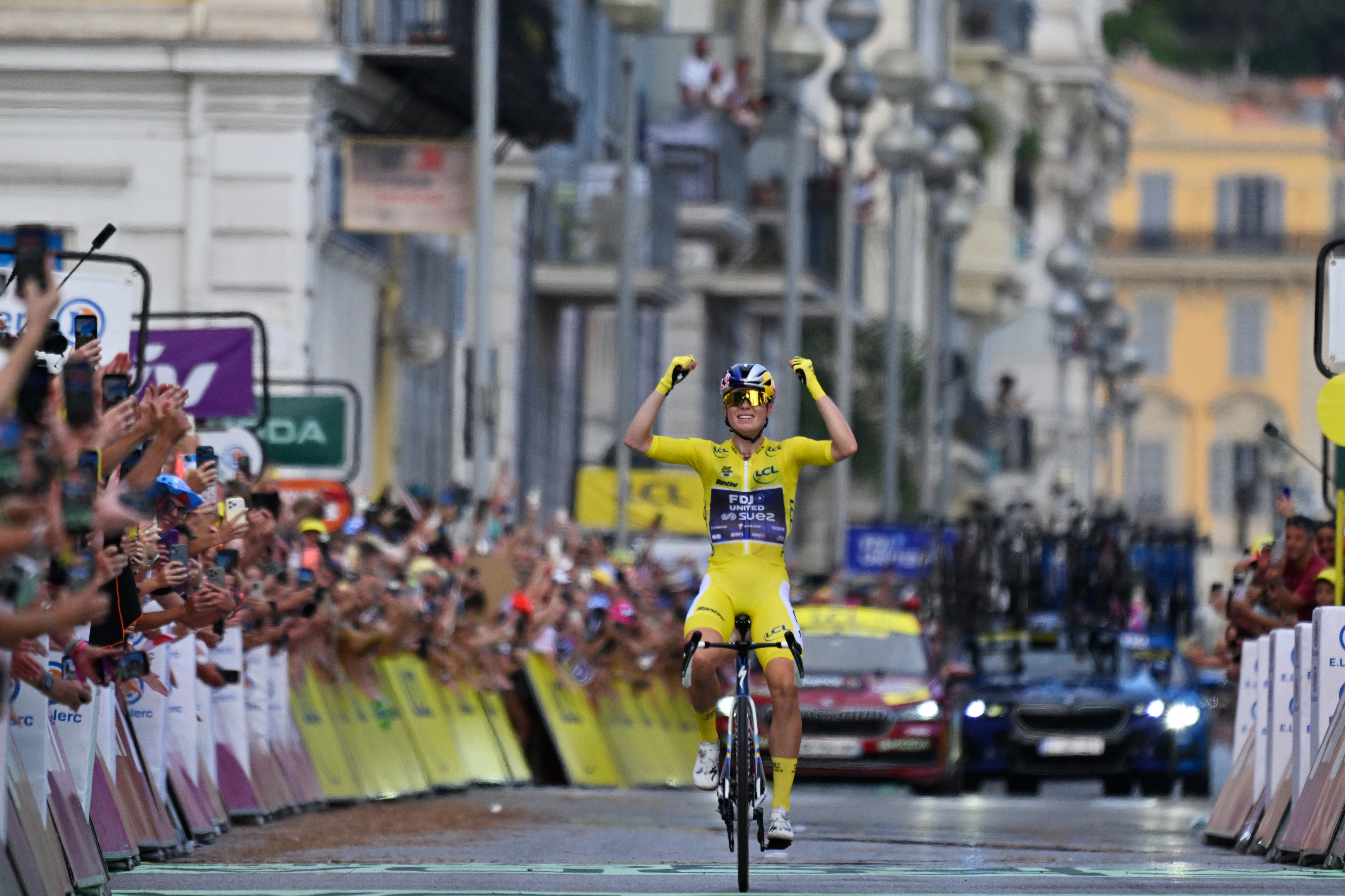 Netherlands' Demi Vollering celebrates as she crosses the finish line to win the ninth stage of the Women's Tour de France cycling race (Tour de France Femmes) in Nice, France, Sunday, Aug. 9, 2026. 