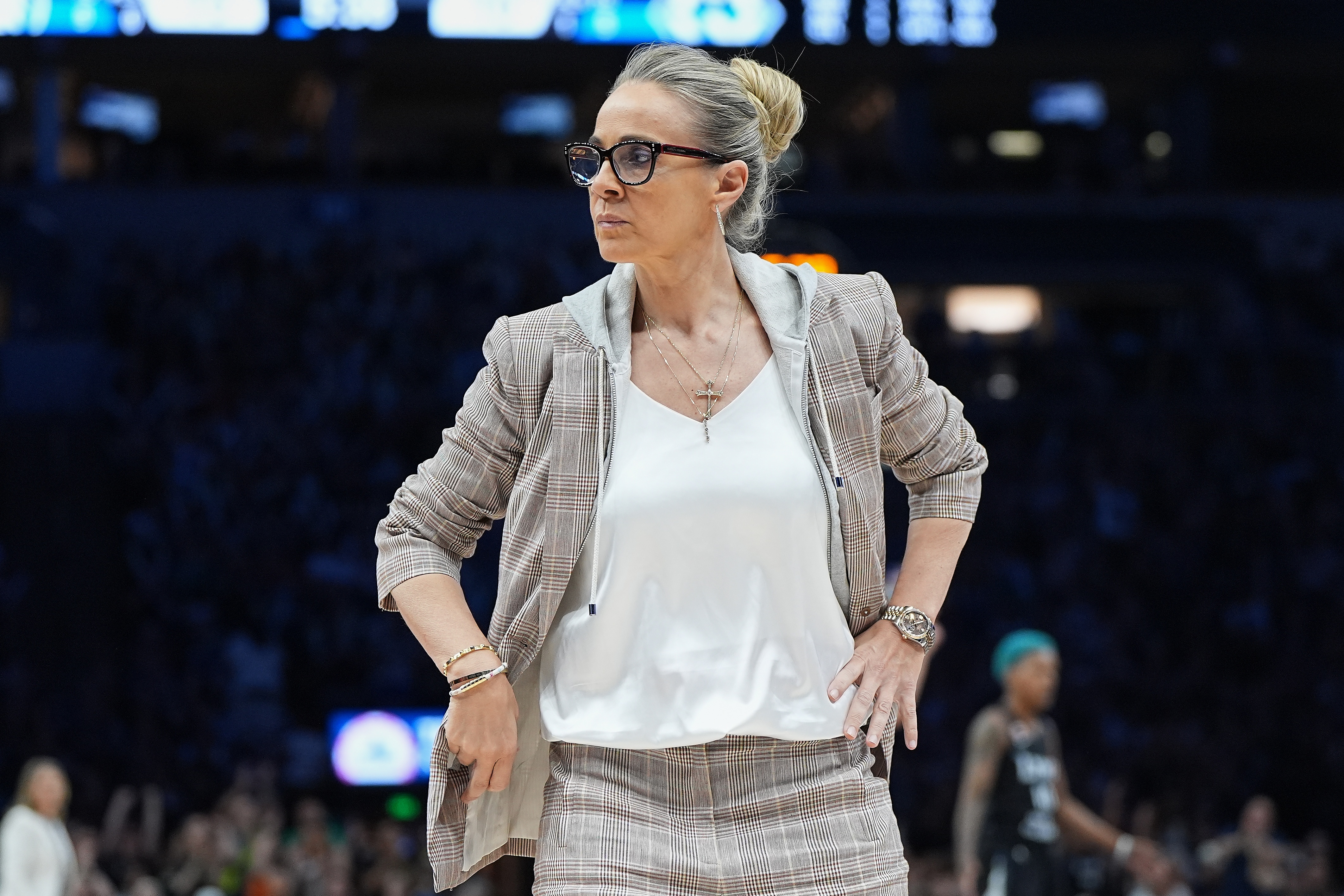 Las Vegas Aces head coach Becky Hammon stands on the court during a timeout in the first half of a WNBA basketball game against the Minnesota Lynx Saturday, Aug. 8, 2026, in Minneapolis. 