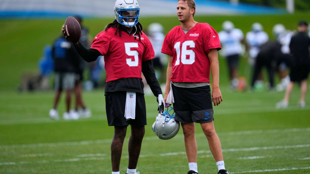 Detroit Lions quarterbacks Teddy Bridgewater (5) talks with Jared Goff (16) during practice at the NFL football team's training camp, in Allen Park, Mich., Sunday, Aug. 2, 2026.