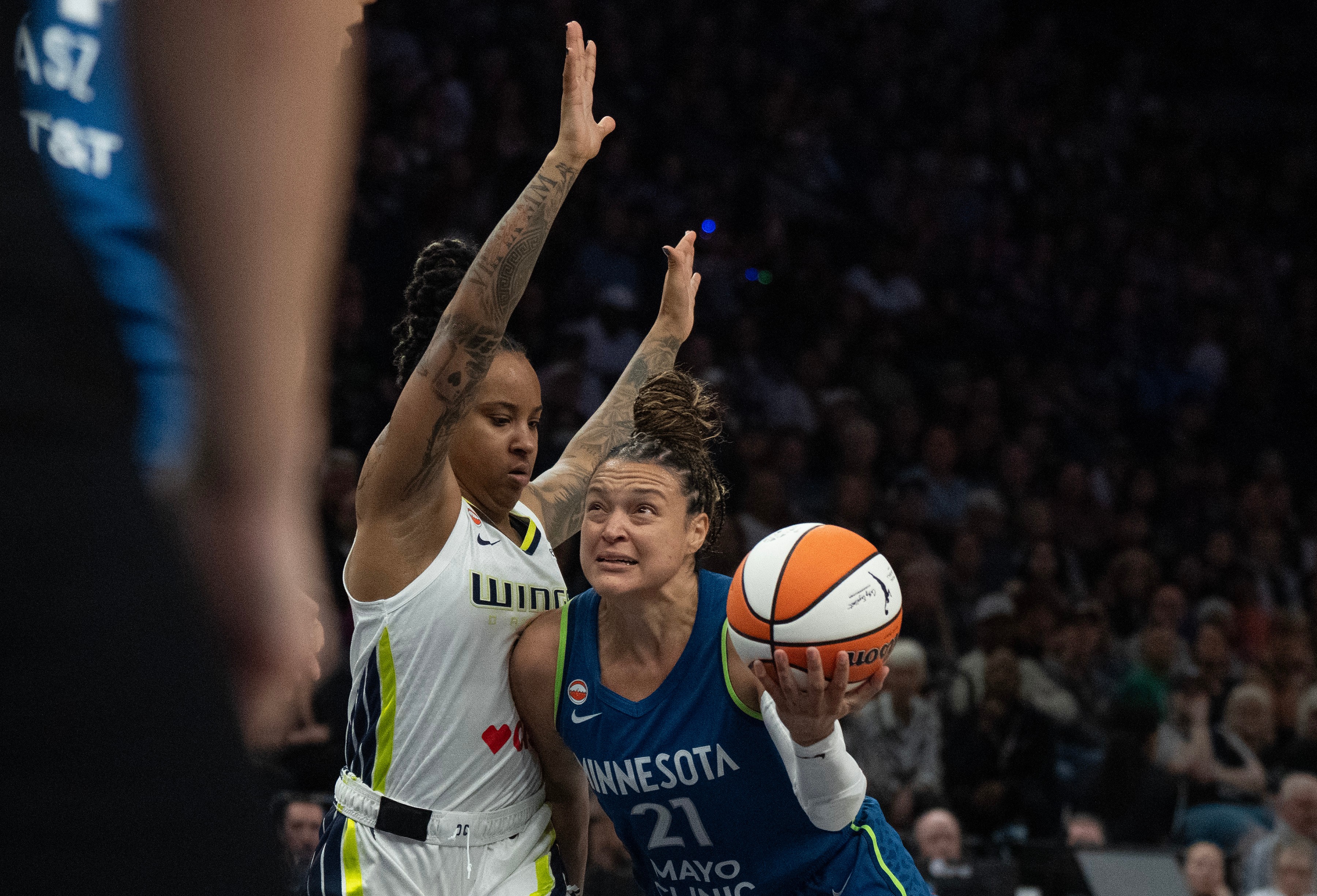Minnesota Lynx guard Kayla McBride (21) dribbles to the basket on Dallas Wings guard Aziaha James in the fist half of basketball game, Sunday Aug. 9, 2026 in Minneapolis. 