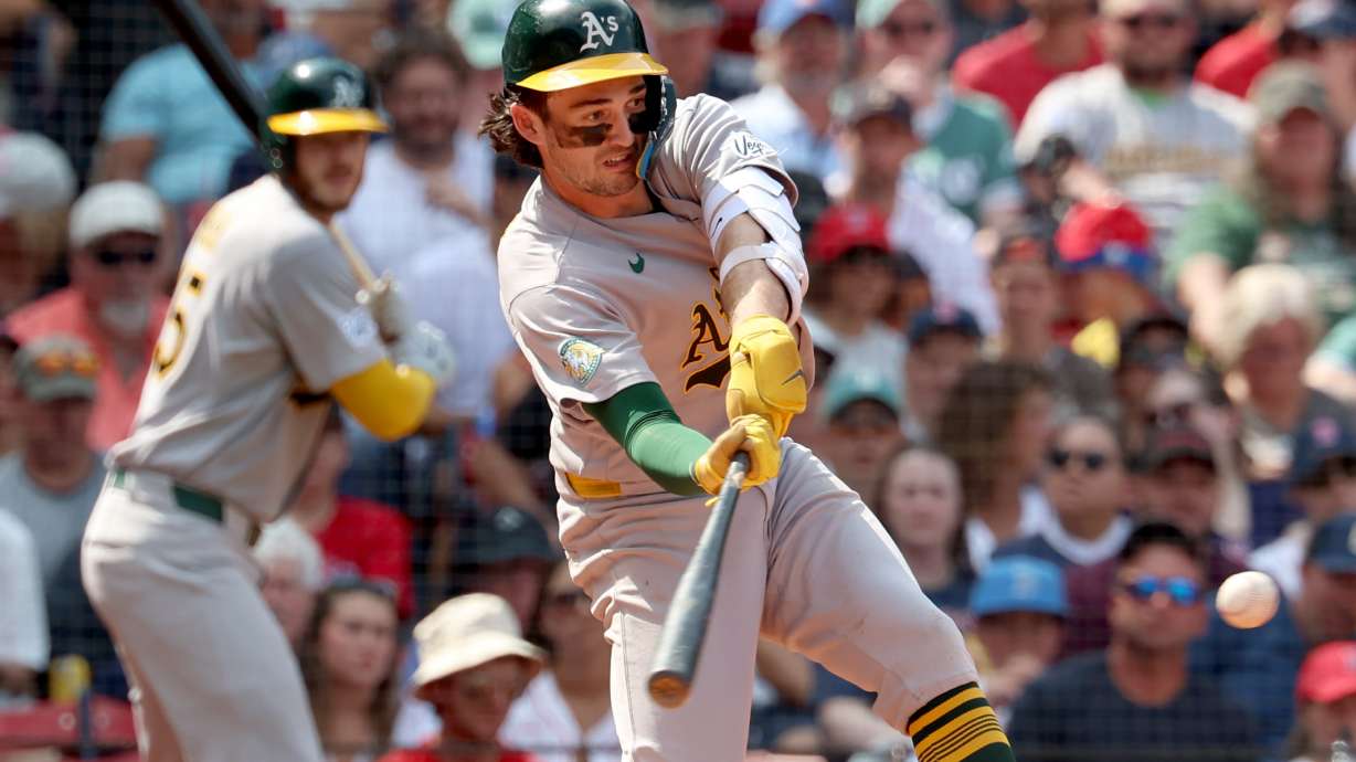 Athletics' Jacob Wilson takes a strike swinging during the fifth inning of a baseball game against the Boston Red Sox, Sunday, Aug. 9, 2026, in Boston.