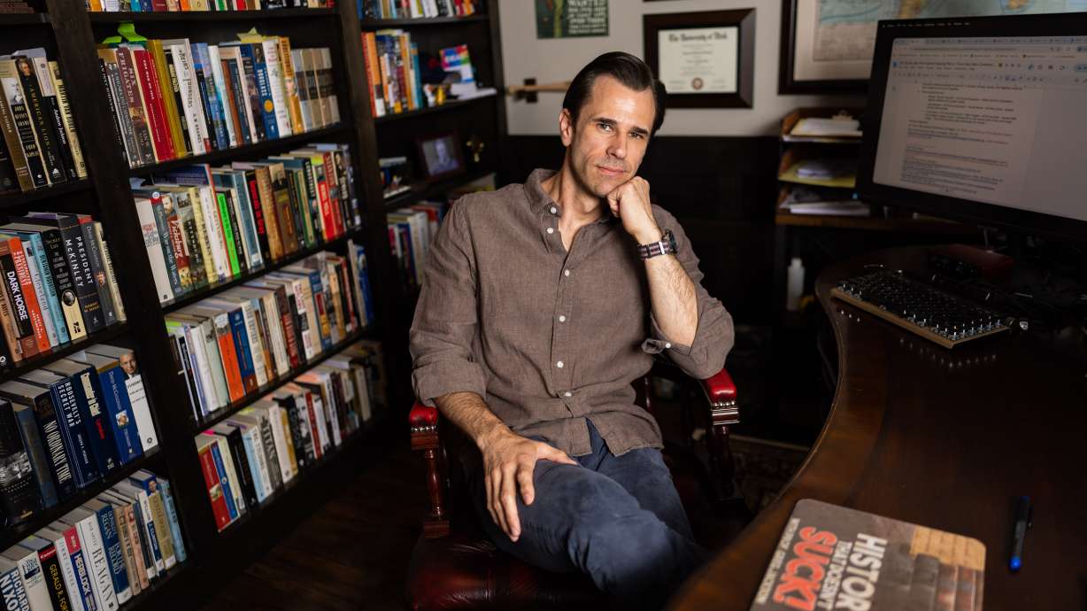 Greg Jackson, a UVU professor, author and podcast host of “History That Doesn’t Suck,” poses at his home in Lehi on July 9. His new book is “Been There, Done That: How Our History Shows What We Can Overcome.”