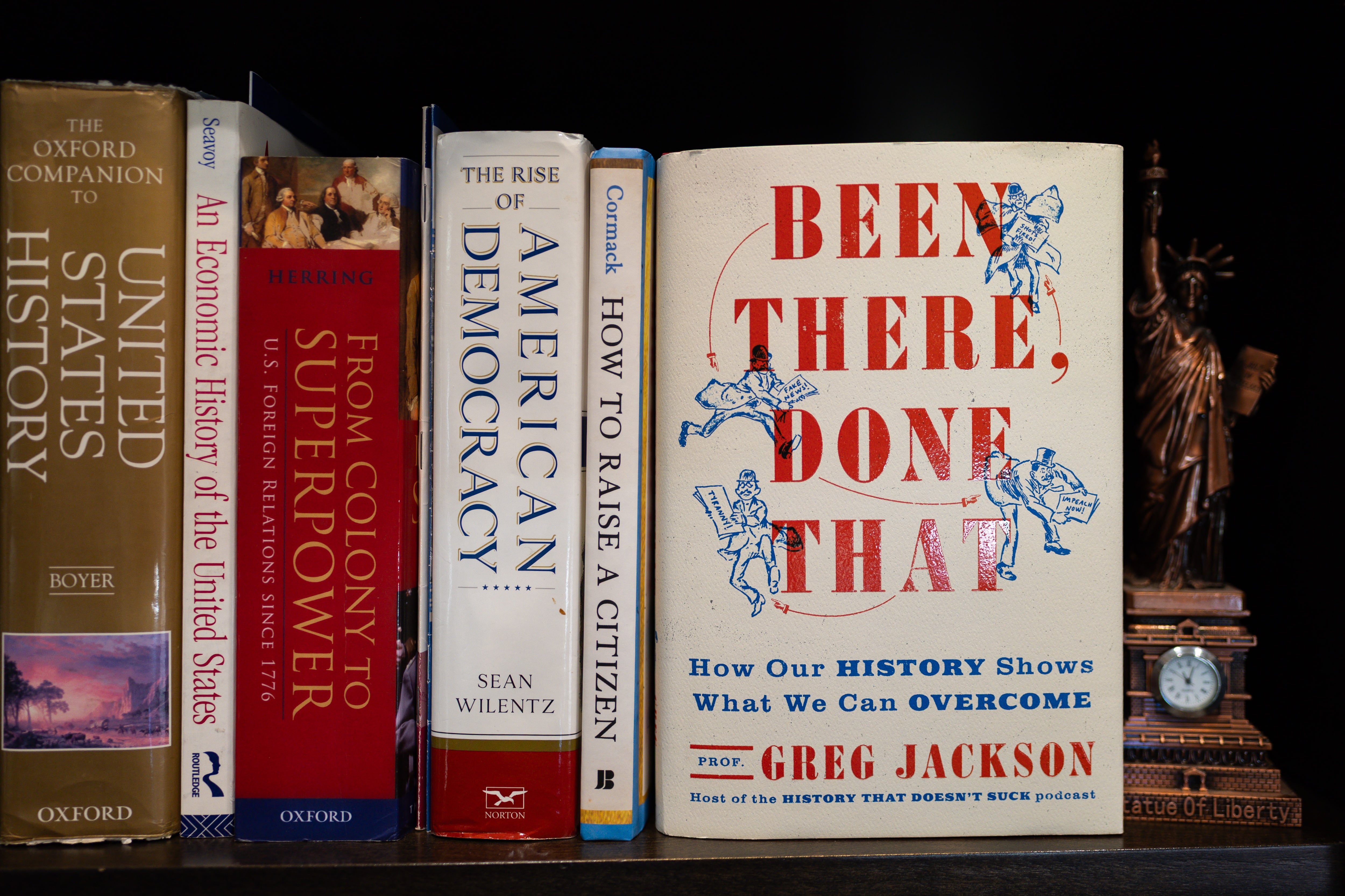 Greg Jackson’s new book “Been There, Done That: How Our History Shows What We Can Overcome” is seen on his bookshelf at his home in Lehi on July 9. Jackson is a UVU professor, author and podcast host of “History That Doesn’t Suck.”