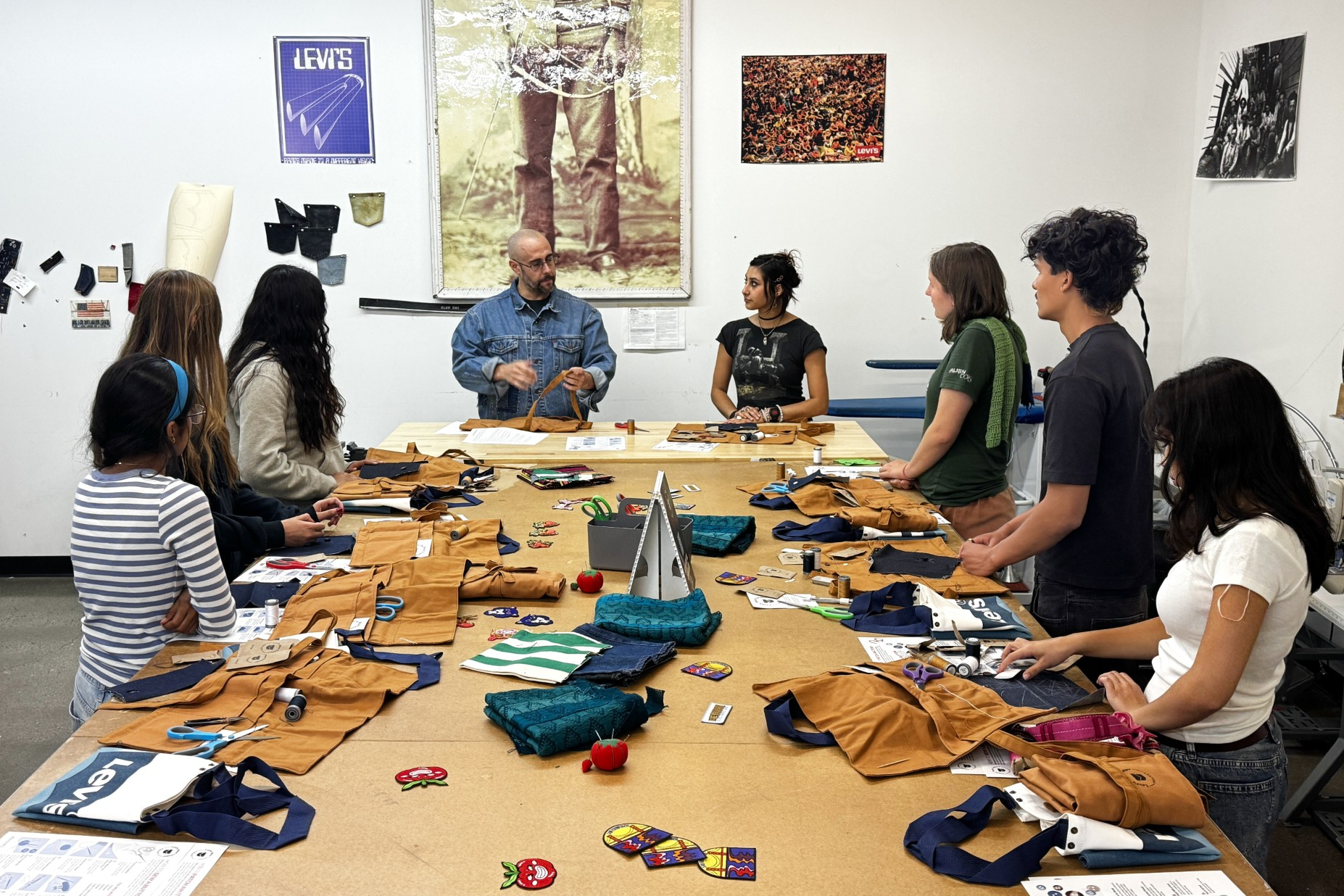 Levi’s employees teach students during a sewing workshop at a Levi's retail store in downtown San Francisco, July 22.