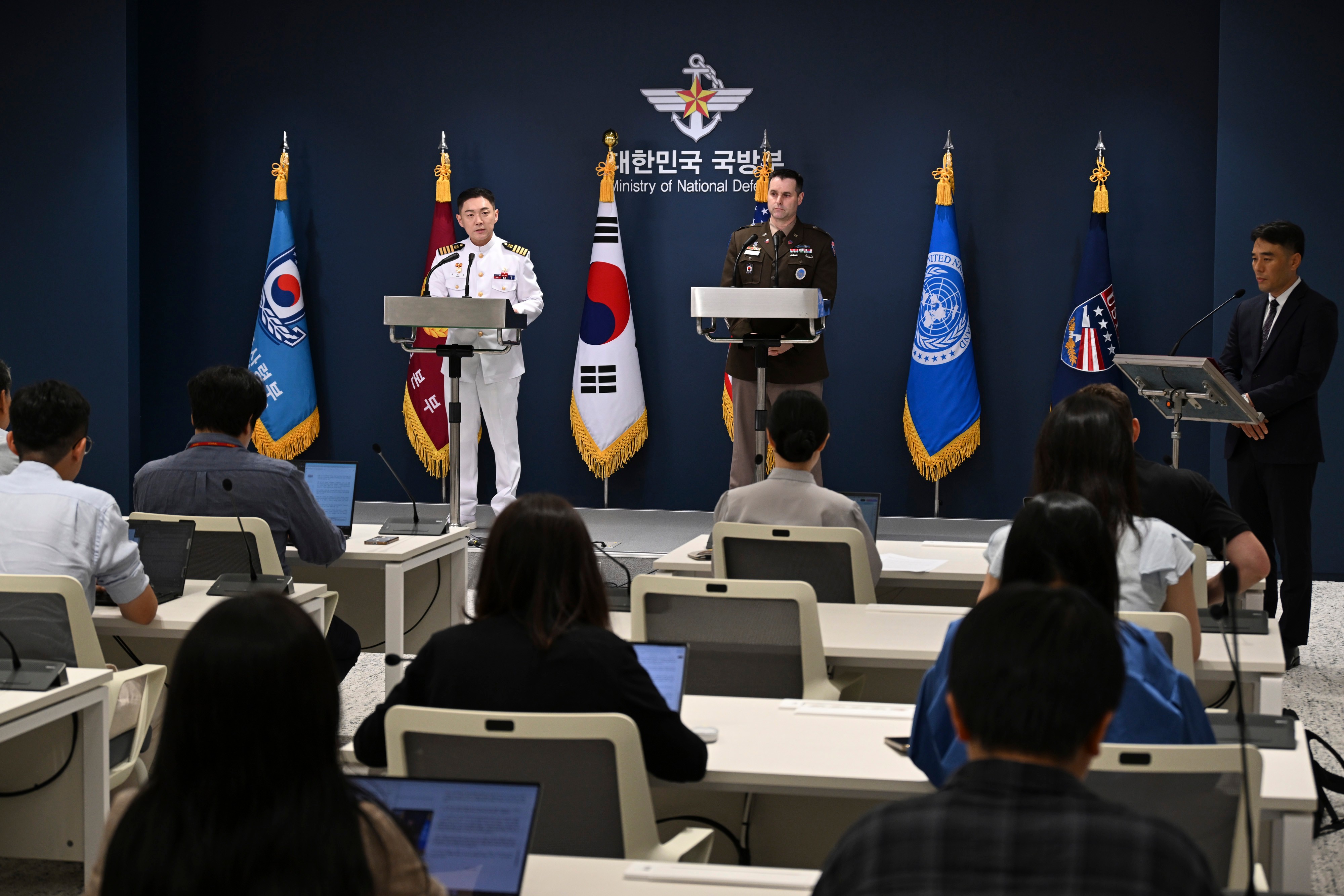 Col. Jang Do-young, center left, public affairs director of South Korea's Joint Chiefs of Staff, and Col. Ryan Donaldn, center right, public affairs director of the United Nations Command, Combined Forces Command and United States Forces Korea a press briefing for the Ulchi Freedom Shield 2026 exercise at the Defense Ministry in Seoul, South Korea Monday.