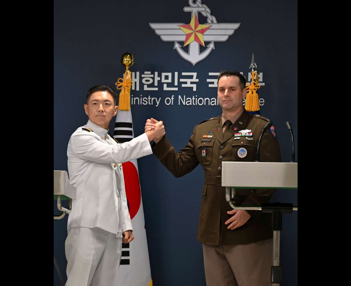 Col. Jang Do-young, left, public affairs director of South Korea's Joint Chiefs of Staff, shakes hands with Col. Ryan Donaldn, public affairs director of the United Nations Command, Combined Forces Command and United States Forces Korea during a press briefing for the Ulchi Freedom Shield 2026 exercise at the Defense Ministry in Seoul, South Korea Monday.