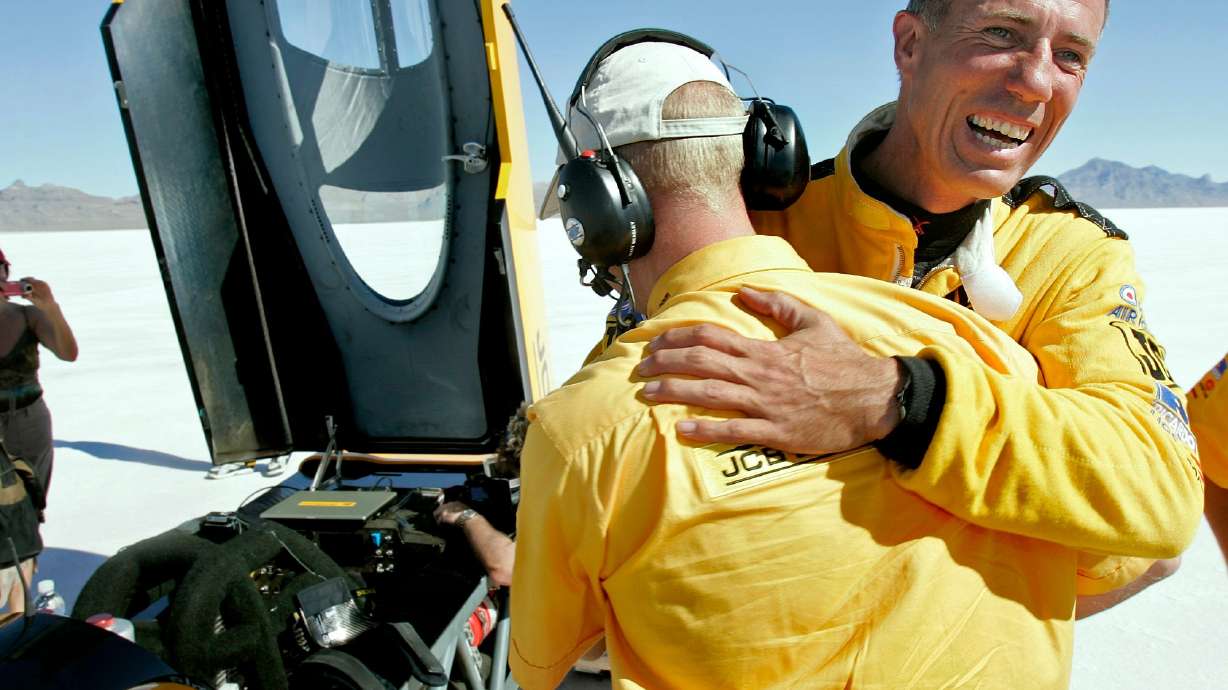 FILE - British driver Andy Green, right, is congratulated by a crew member after setting a new unofficial world diesel powered land speed record of over 328 mph over two runs on the Bonneville Salt Flats in Utah on Tuesday, Aug. 2006.