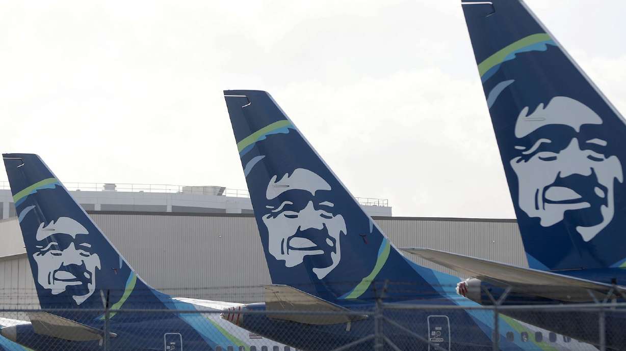 The Alaska Airlines logo is displayed on the tail section of Alaska Airlines planes at San Francisco International Airport on January 25, 2024.