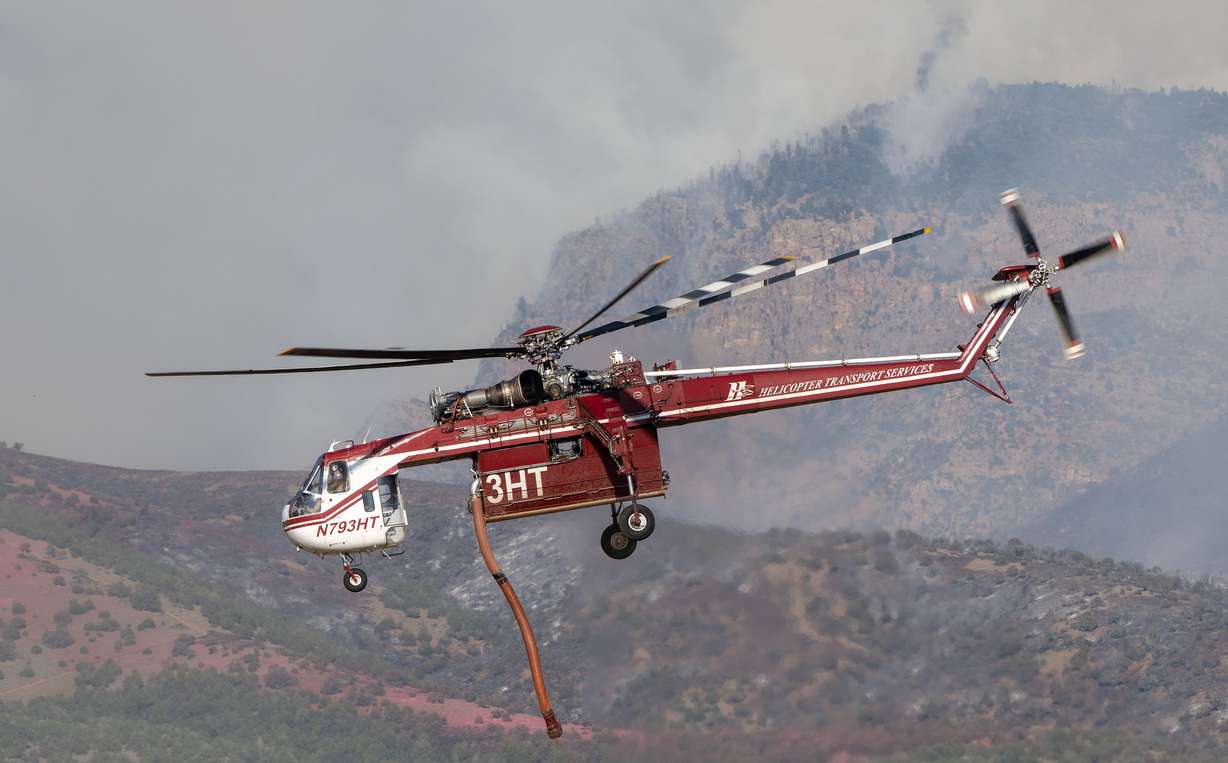 A Sikorsky Skycrane lifts after refilling as crews fight the Widemouth 2 Fire east of Fillmore on Aug. 4.
