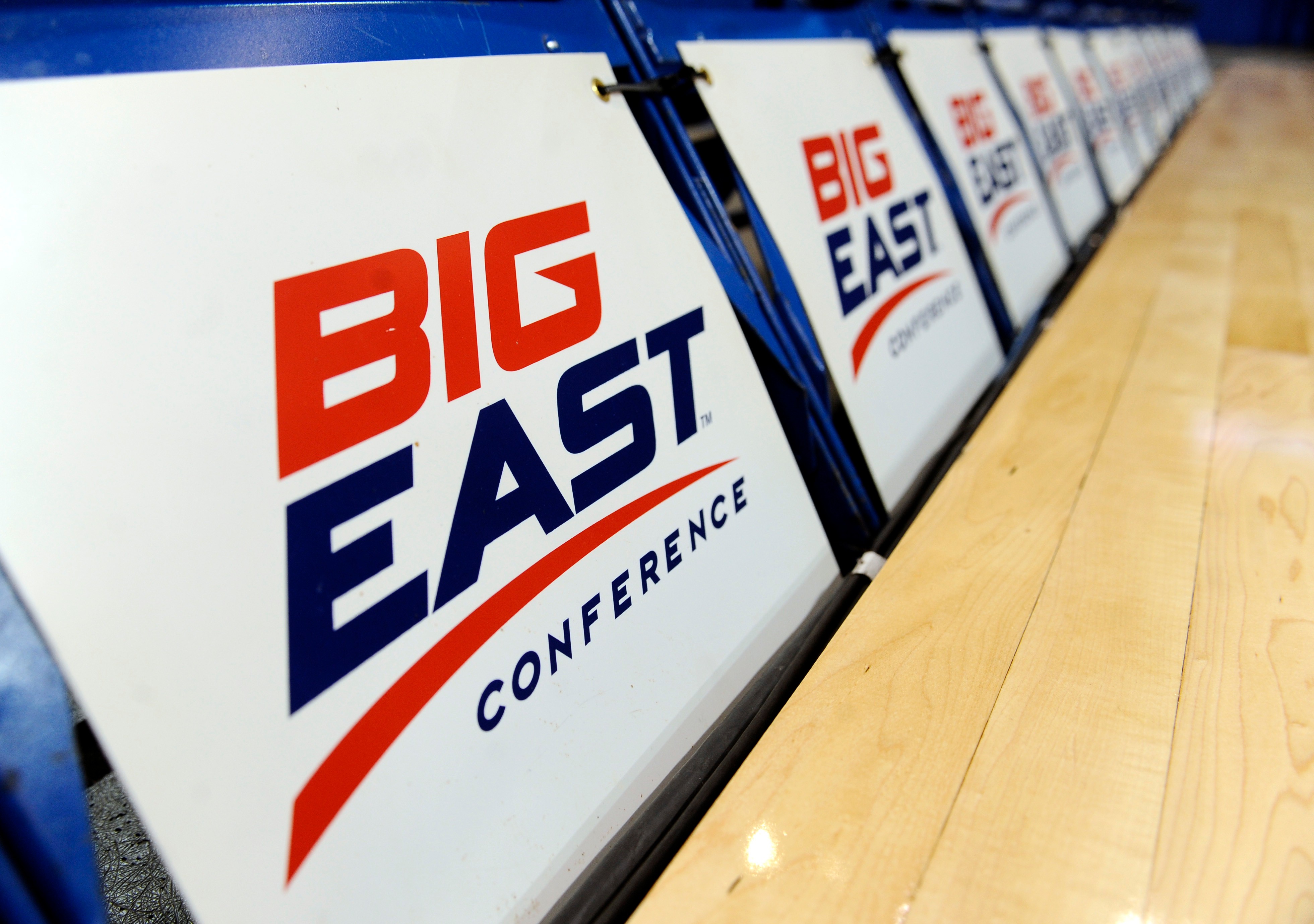 FILE - The logo for the Big East Conference is displayed on a row of court side chairs at the Big East Conference women's basketball tournament in Hartford, Conn., March 8, 2013. 