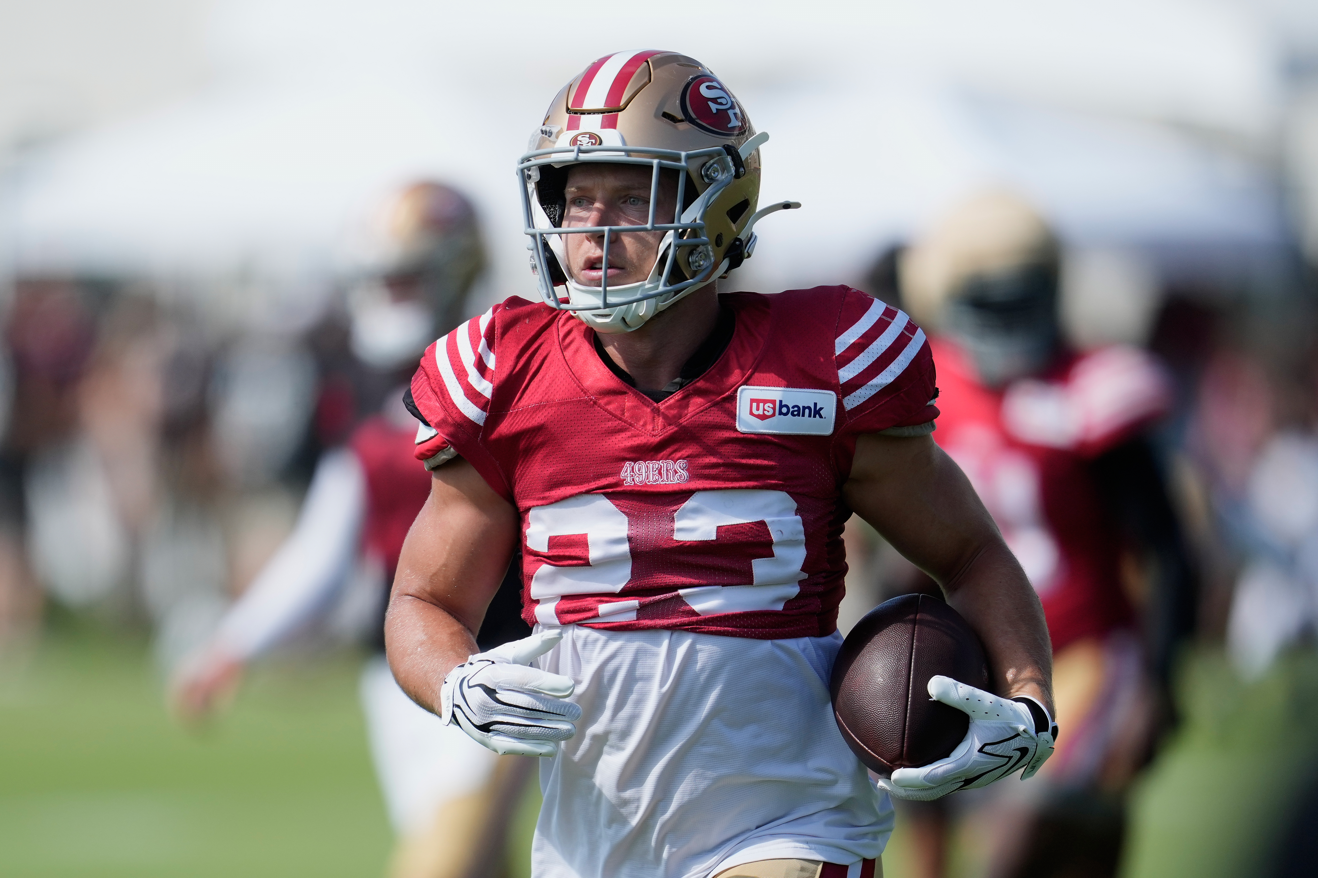 San Francisco 49ers running back Christian McCaffrey (23) runs during the NFL football team's training camp, Thursday, Aug. 6, 2026, in Santa Clara, Calif. 