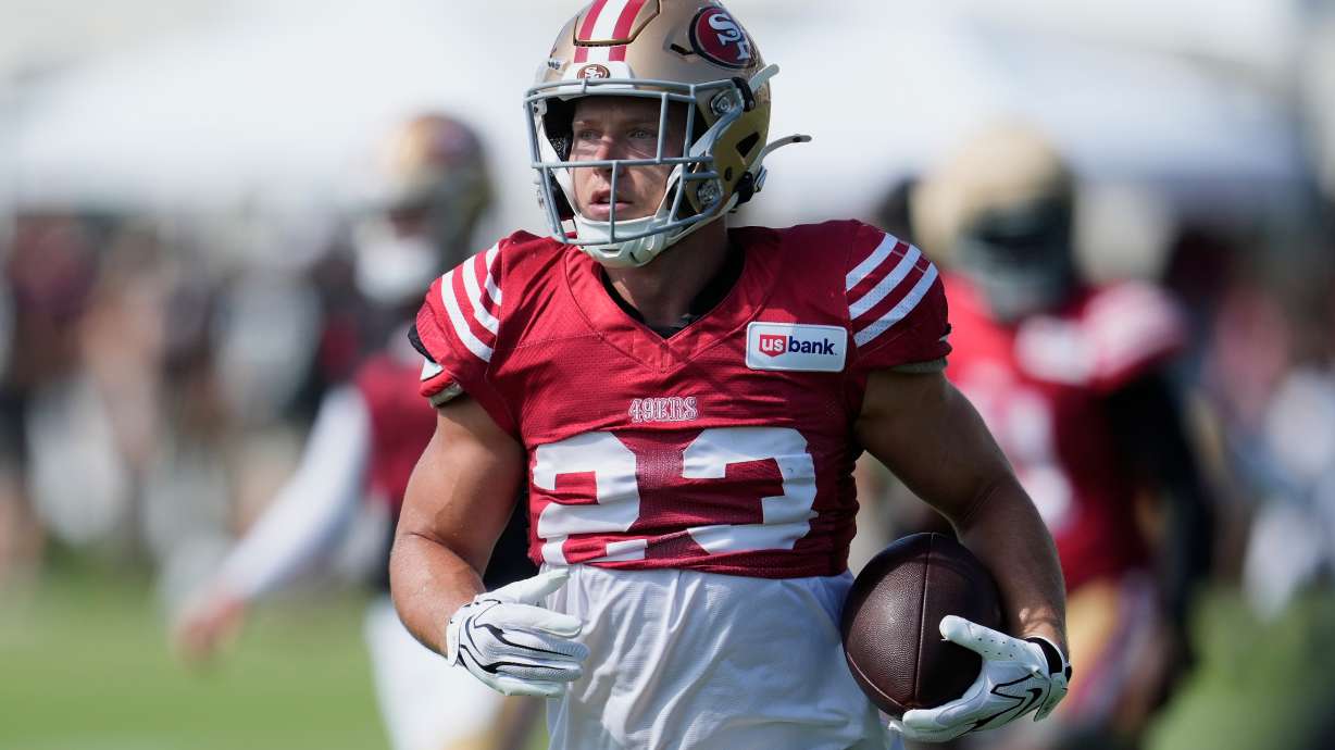 San Francisco 49ers running back Christian McCaffrey (23) runs during the NFL football team's training camp, Thursday, Aug. 6, 2026, in Santa Clara, Calif.