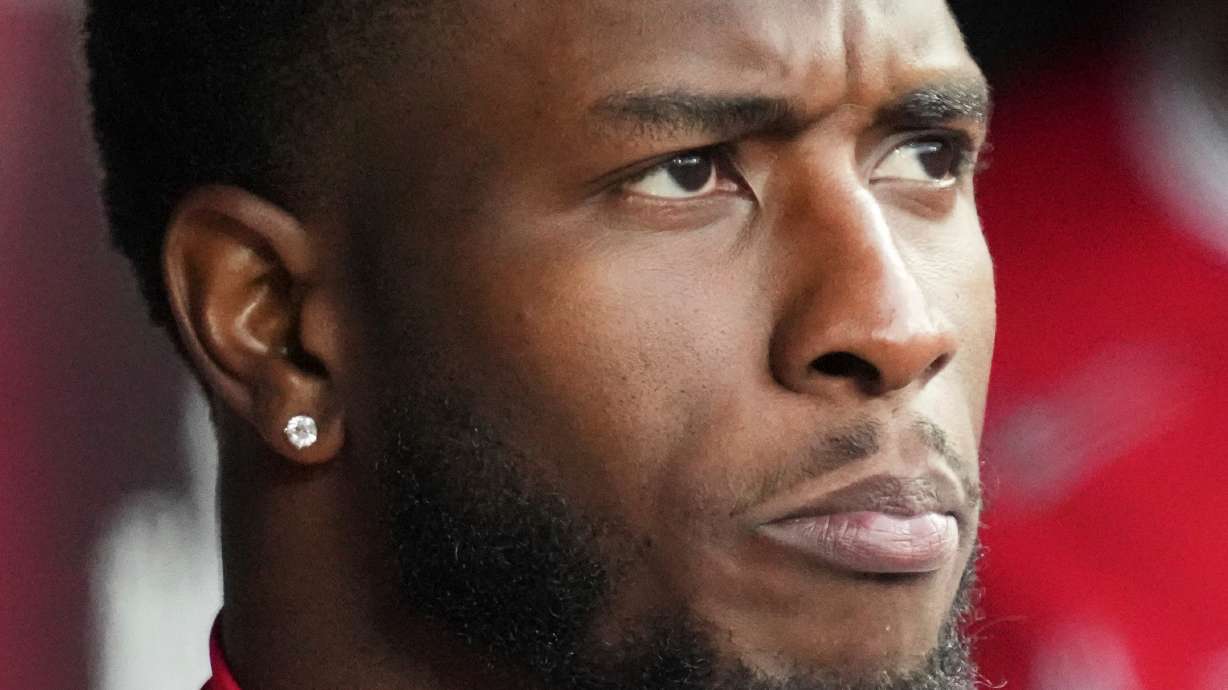 FILE - Tim Anderson, with Los Angeles Angels, looks to the field during the ninth inning of an opening-day baseball game against the Chicago White Sox in Chicago, March 27, 2025.