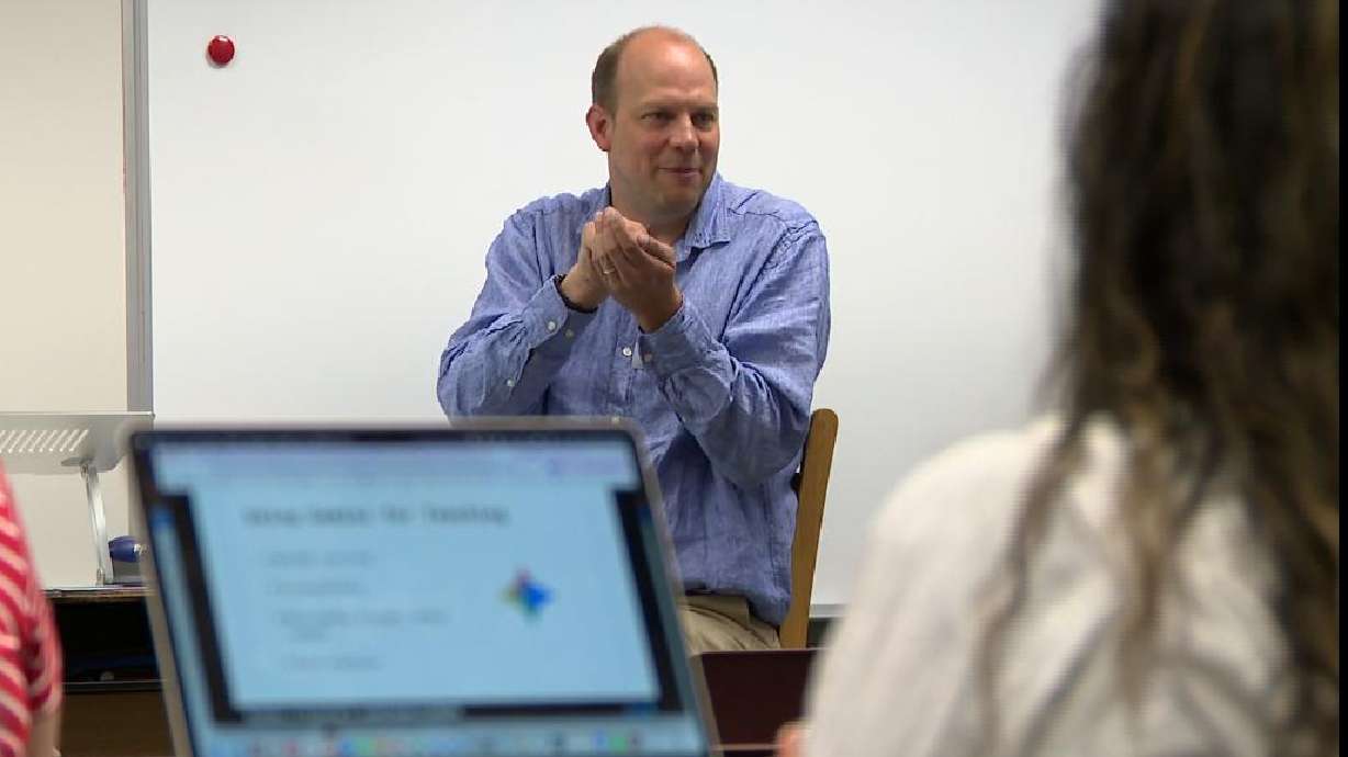 John Stewart demonstrates an artificial intelligence program for teachers in the Canyons District. He used AI to turn his daughter's textbooks into podcasts, to help her work around dyslexia.