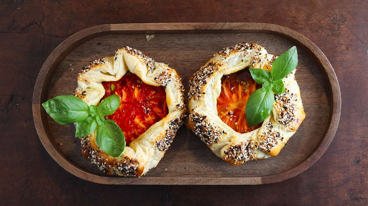 These mini tomato galettes pair flaky puff pastry with creamy, herby goat cheese and juicy heirloom tomatoes, and they look as good as they taste!