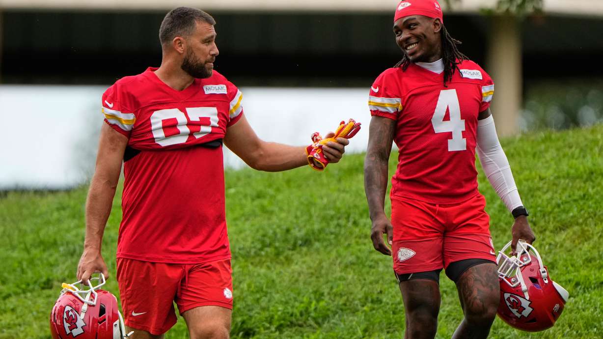 Kansas City Chiefs tight end Travis Kelce (87), and wide receiver Rashee Rice (4) walk to NFL football training camp Friday, July 31, 2026, in St. Joseph, Mo.