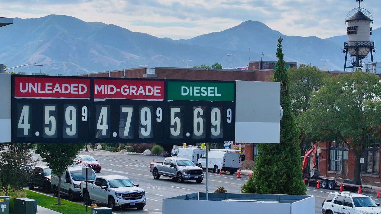 Gas prices are posted at Smith's Fuel Center as traffic moves along 500 South in Salt Lake City on Tuesday.