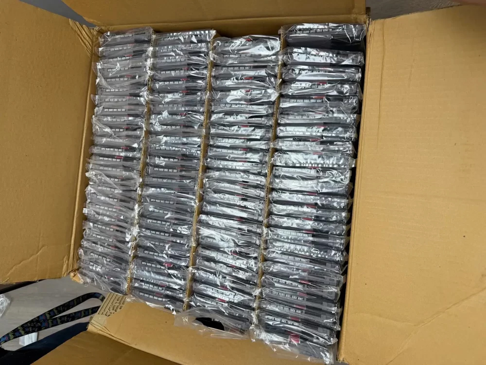 This photo provided by Nintendo Wire shows a box of nearly 100 uncirculated Nintendo Entertainment System copies of Super Mario Bros. and Duck Hunt on Wednesday, June 17, rediscovered in a warehouse in Waukesha, Wis., by OneStopWonders store owner Kevin Braun and Nintendo Wire publisher Jason Ganos.