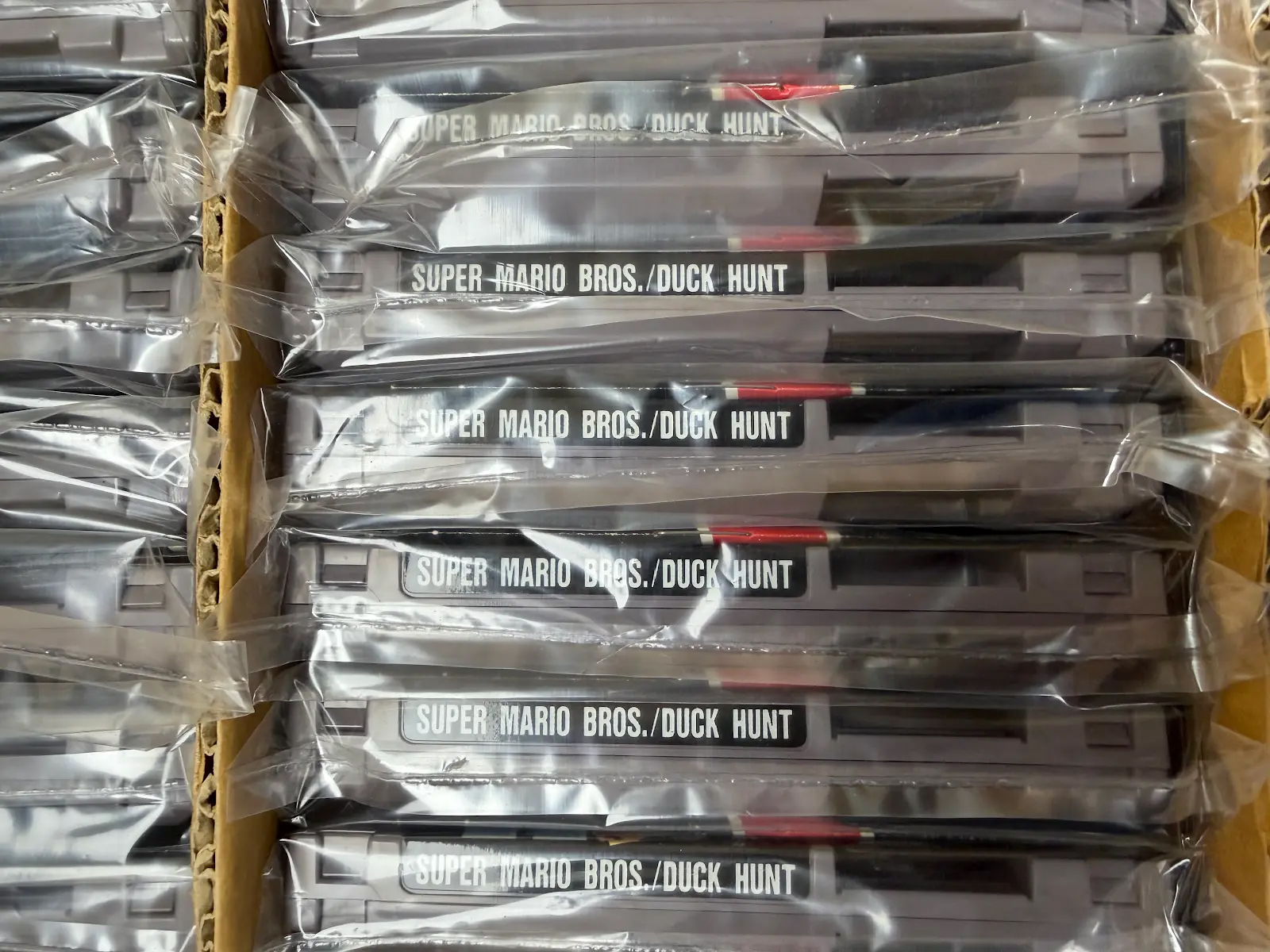 This photo provided by Nintendo Wire shows a box of nearly 100 uncirculated Nintendo Entertainment System copies of Super Mario Bros. and Duck Hunt on Wednesday, June 17, rediscovered in a warehouse in Waukesha, Wis., by OneStopWonders store owner Kevin Braun and Nintendo Wire publisher Jason Ganos.