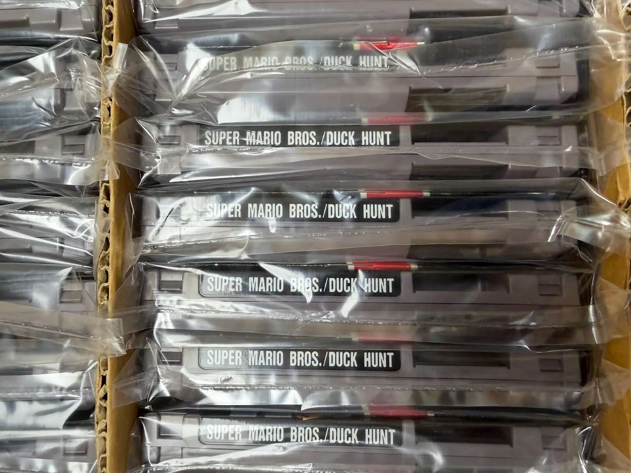This photo provided by Nintendo Wire shows a box of nearly 100 uncirculated Nintendo Entertainment System copies of Super Mario Bros. and Duck Hunt on Wednesday, June 17, rediscovered in a warehouse in Waukesha, Wis., by OneStopWonders store owner Kevin Braun and Nintendo Wire publisher Jason Ganos.