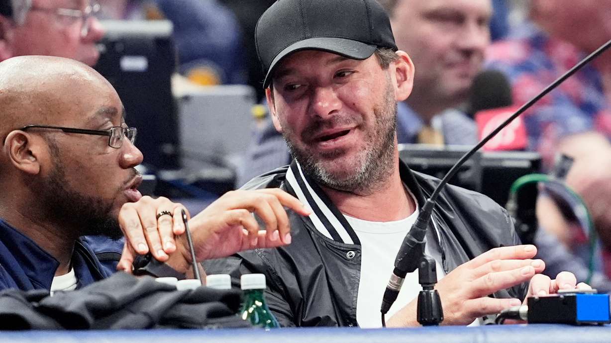 FILE - Former NFL quarterback Tony Romo, right, attends an NBA basketball game between the Indiana Pacers and the Dallas Mavericks on March 5, 2024, in Dallas.