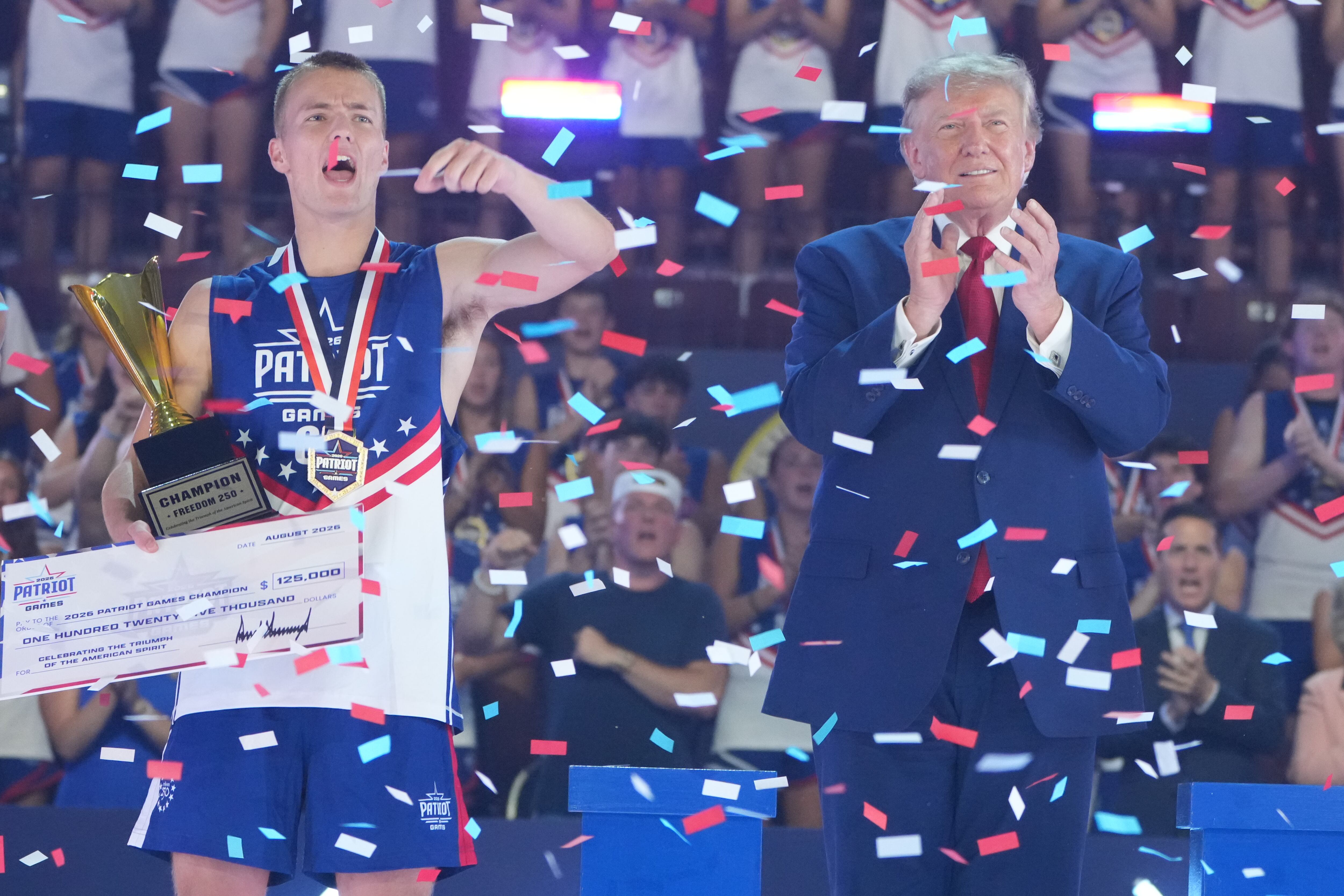Utah's Rockwell Myers, left, celebrates with President Donald Trump at the Patriot Games at Spire Academy in Geneva, Ohio, Tuesday.