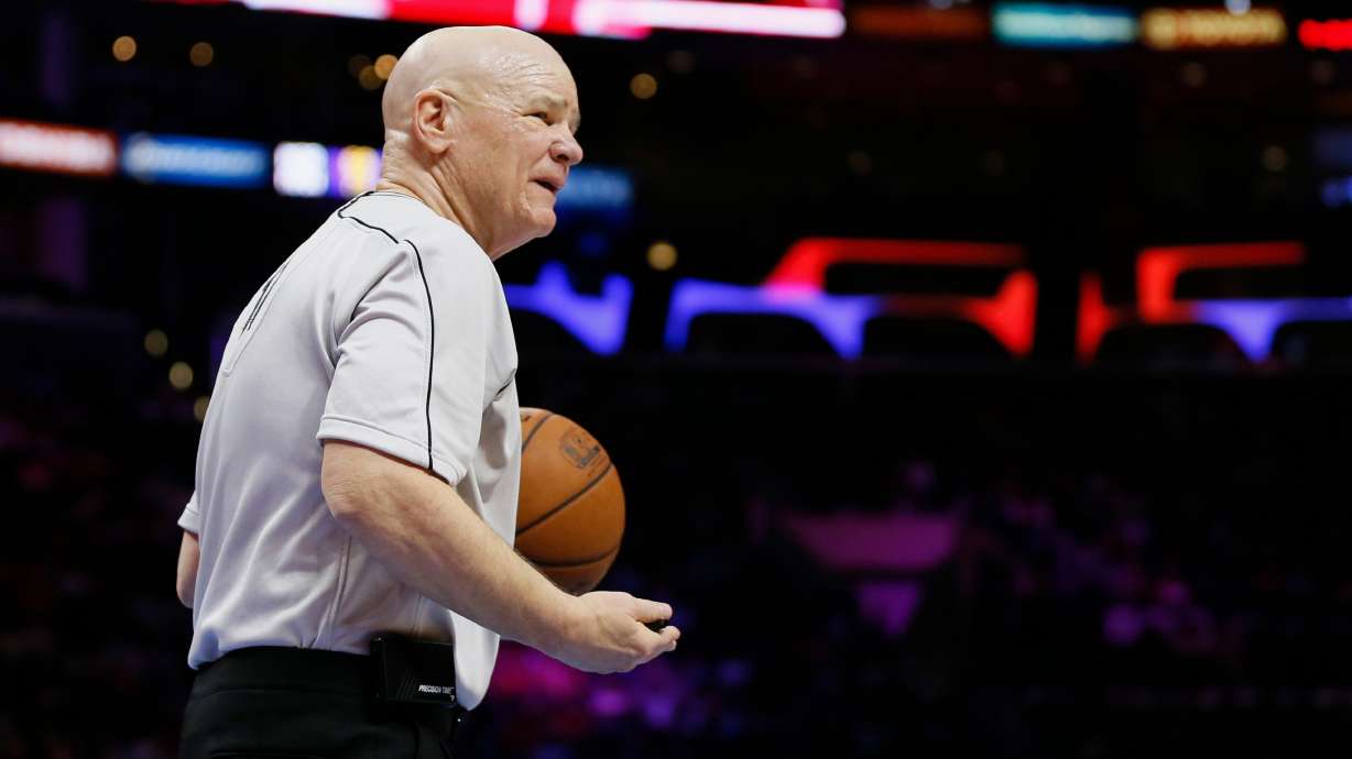 FILE - NBA official Joey Crawford is seen during an NBA basketball game between the Los Angeles Clippers and Milwaukee Bucks, Dec. 20, 2014, in Los Angeles.