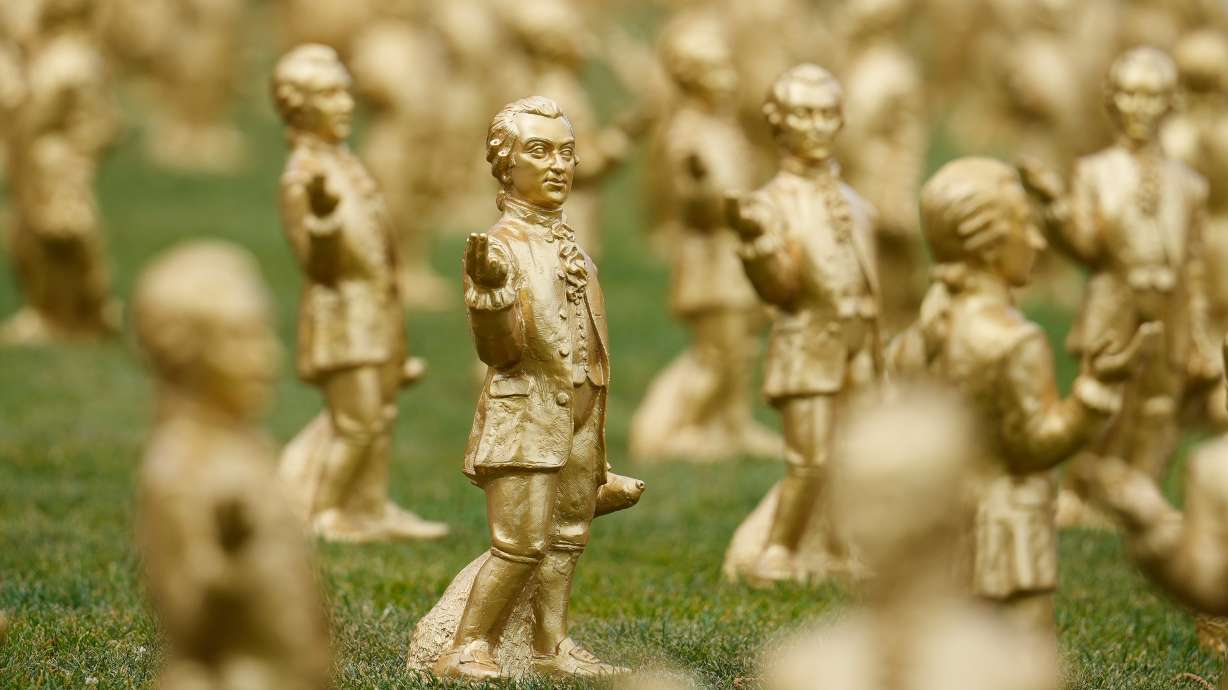 Some of the 400 gold colored plastic Mozart sculptures by German artist Ottmar Hoerl from Nuremberg for the 270th birthday of composer Wolfgang Amadeus Mozart in Salzburg, Austria, on July 15. Over 200 disappeared, officials said on Wednesday.